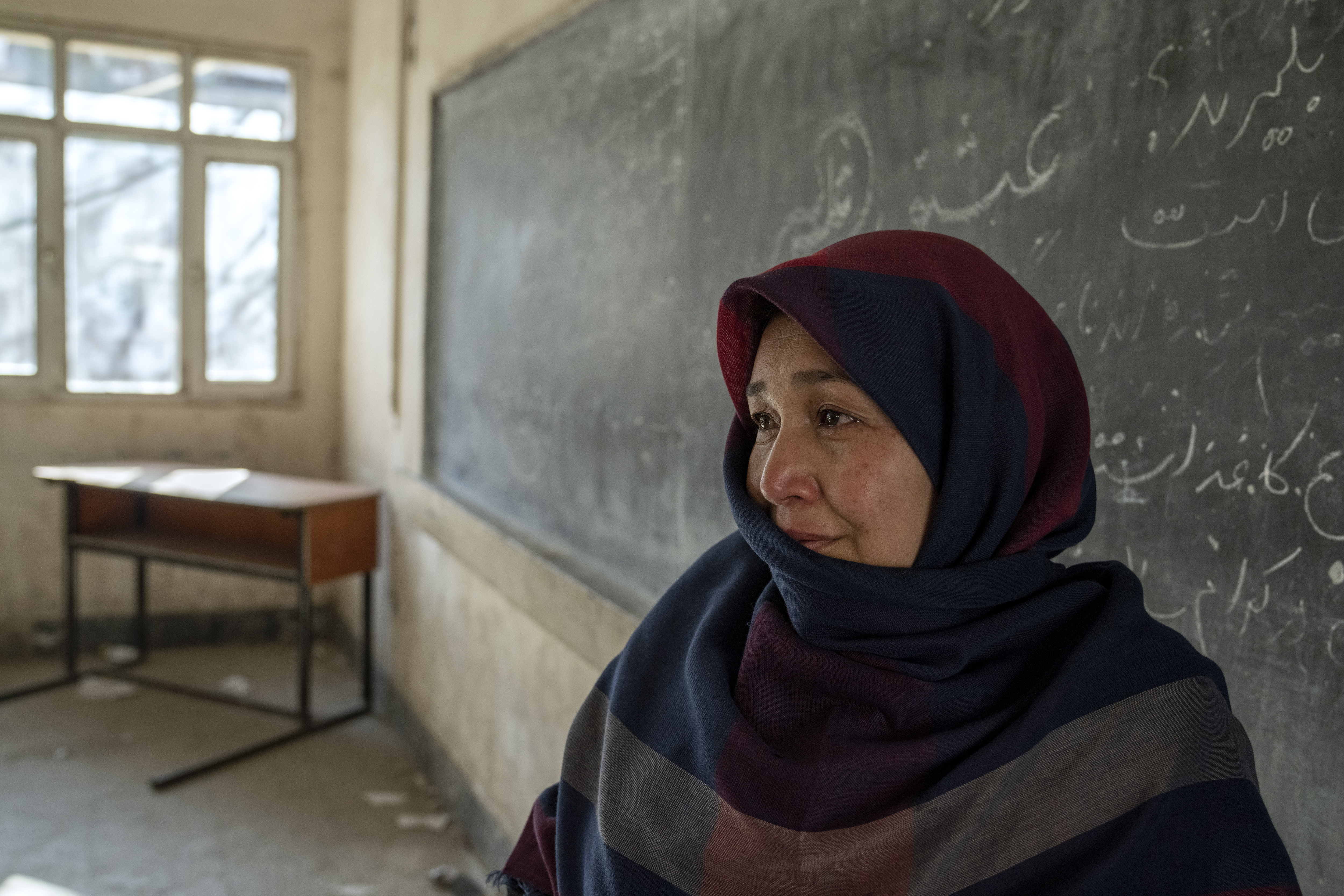 Amanah Nashenas, 45-year-old an Afghan teacher, cries during an interview.