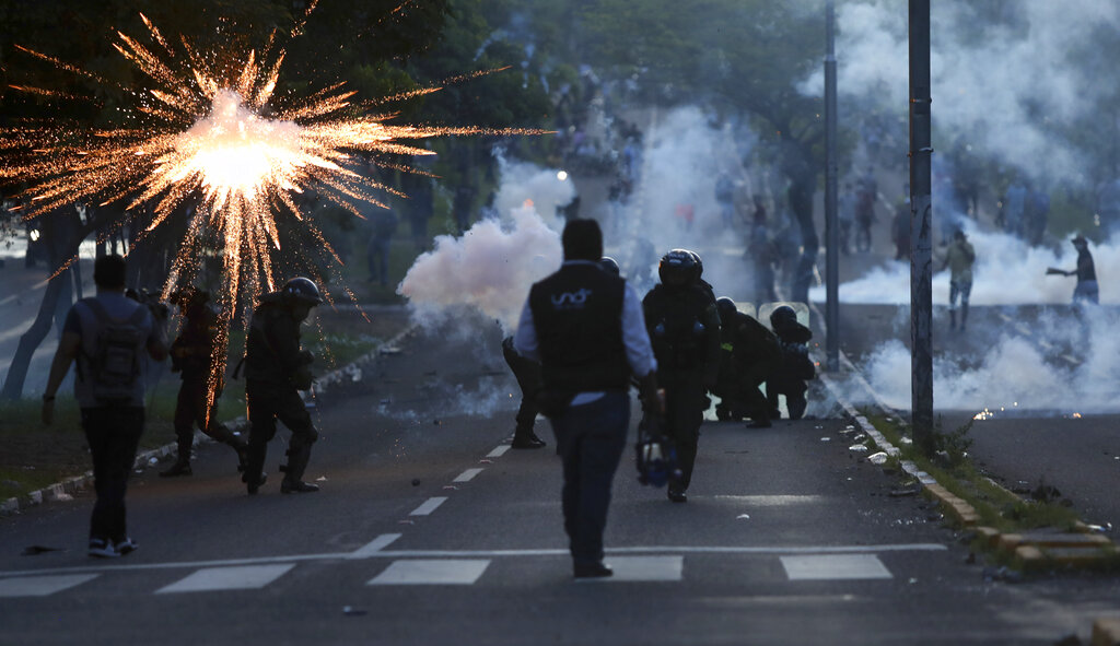 Police clash with supporters of Luis Fernando Camacho, governor of Santa Cruz, during a protest in Santa Cruz, Bolivia, on December 30, 2022 [Ipa Ibáñez/AP Photo]