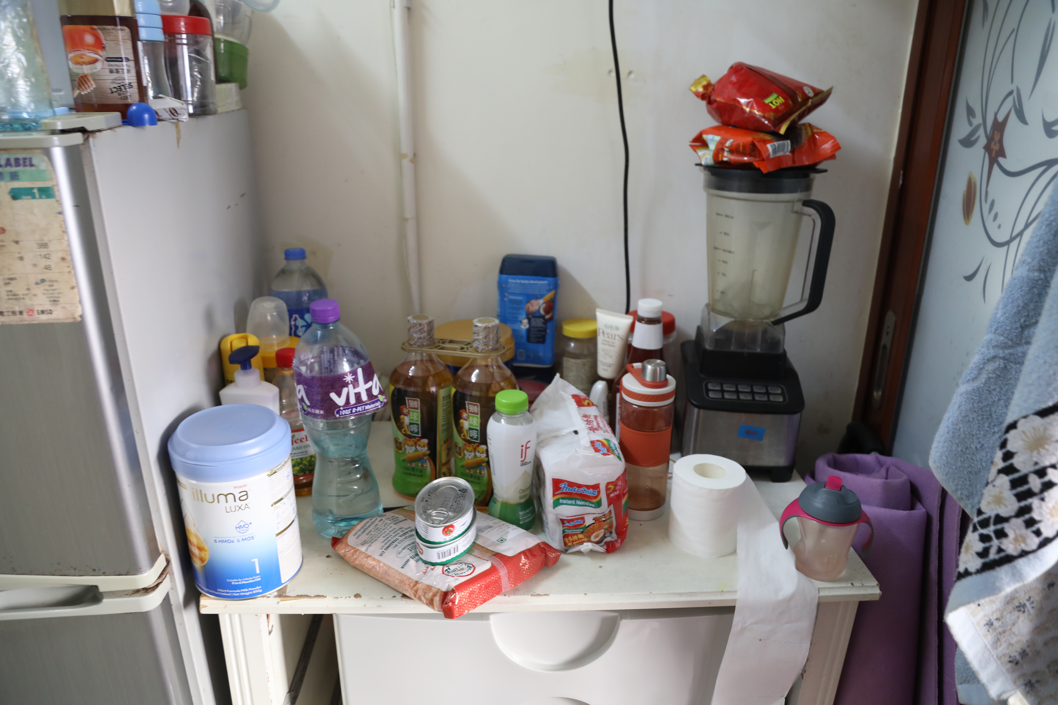 A kitchen in a small apartment in Hong Kong