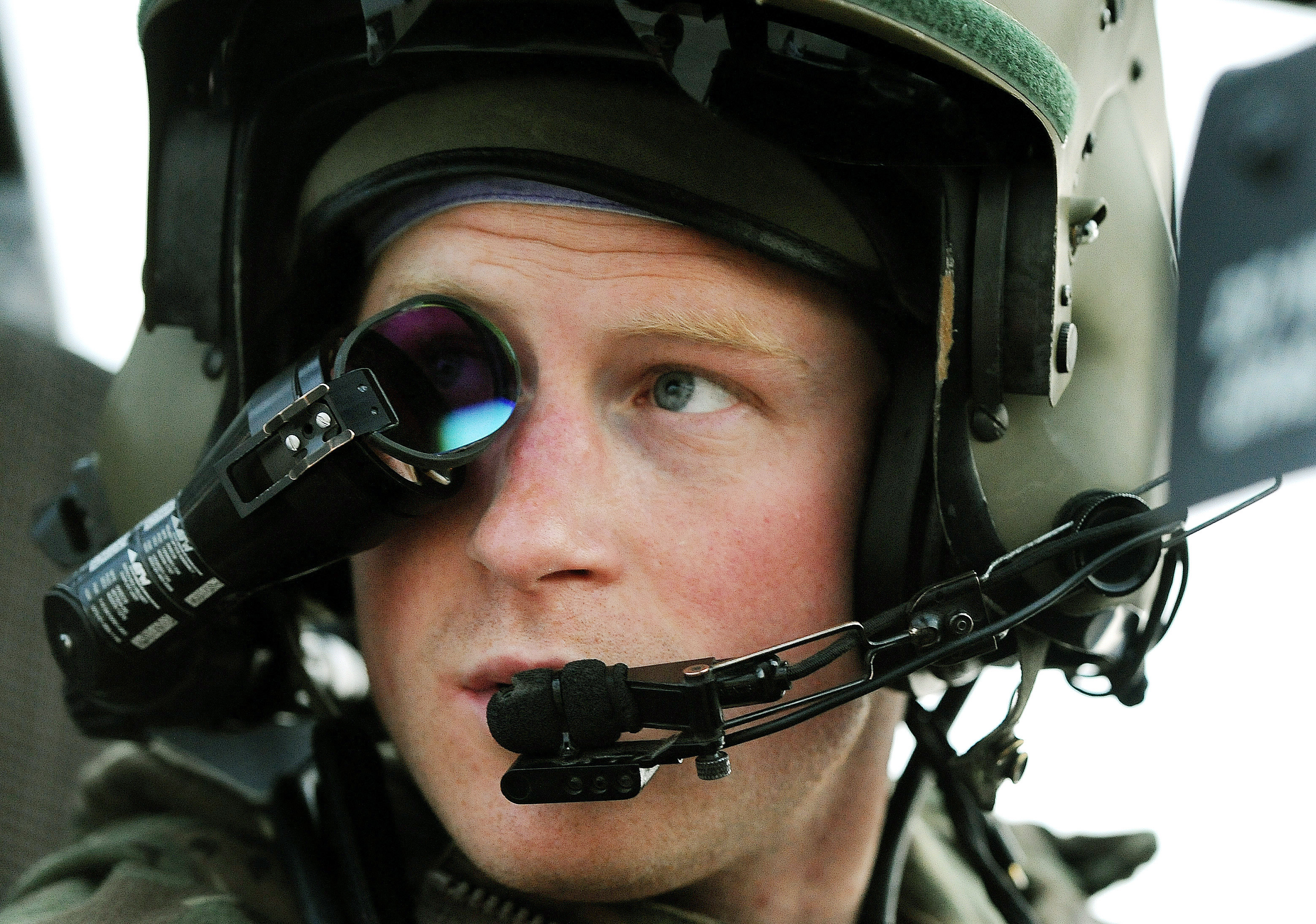 Britain's Prince Harry wears his monocle gun sight as he sits in his Apache helicopter at Camp Bastion, southern Afghanistan.