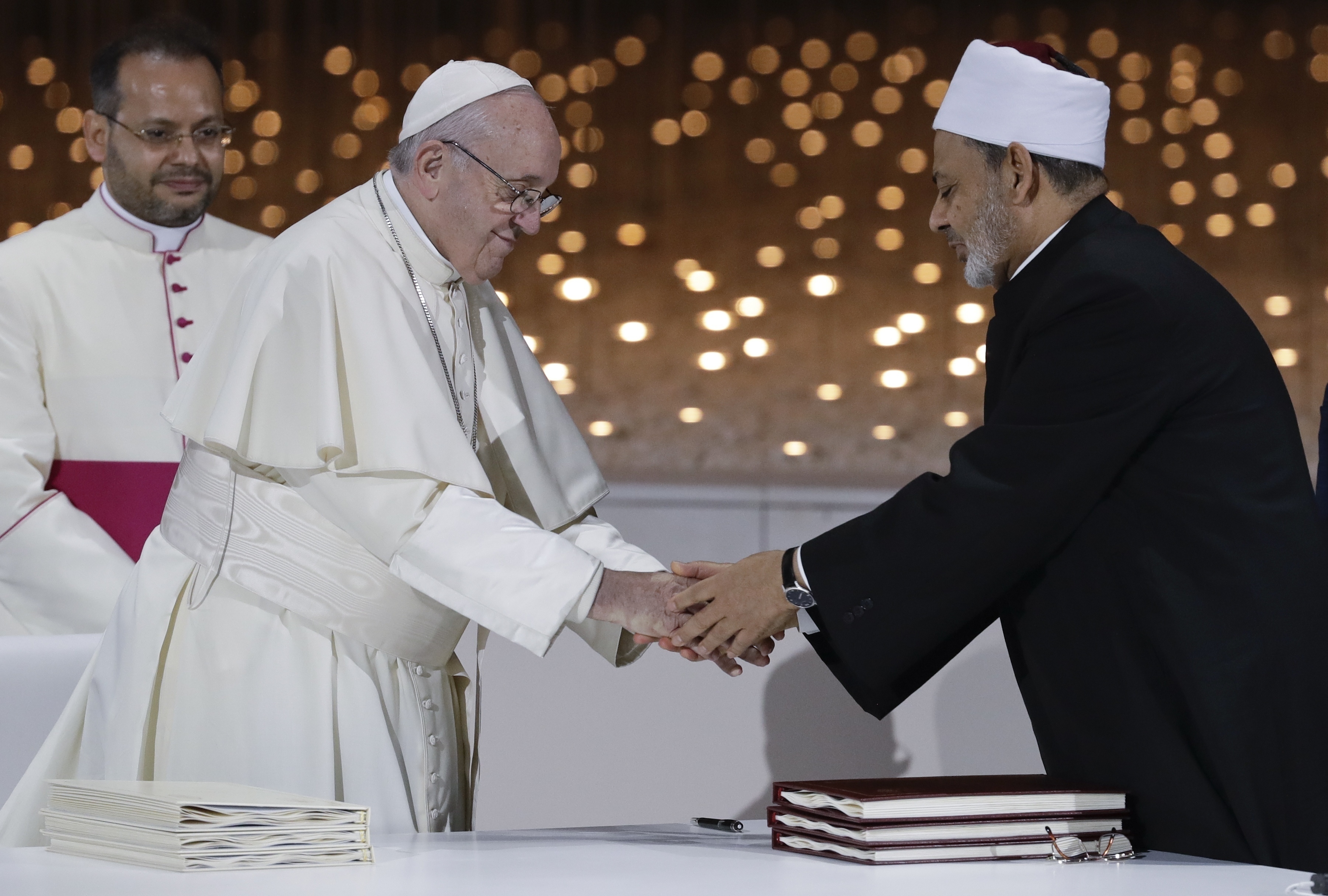 Pope Francis greets Sheikh Ahmad al-Tayyeb, the grand imam of Egypt's Al-Azhar, after an Interreligious meeting at the Founder's Memorial in Abu Dhabi, United Arab Emirates