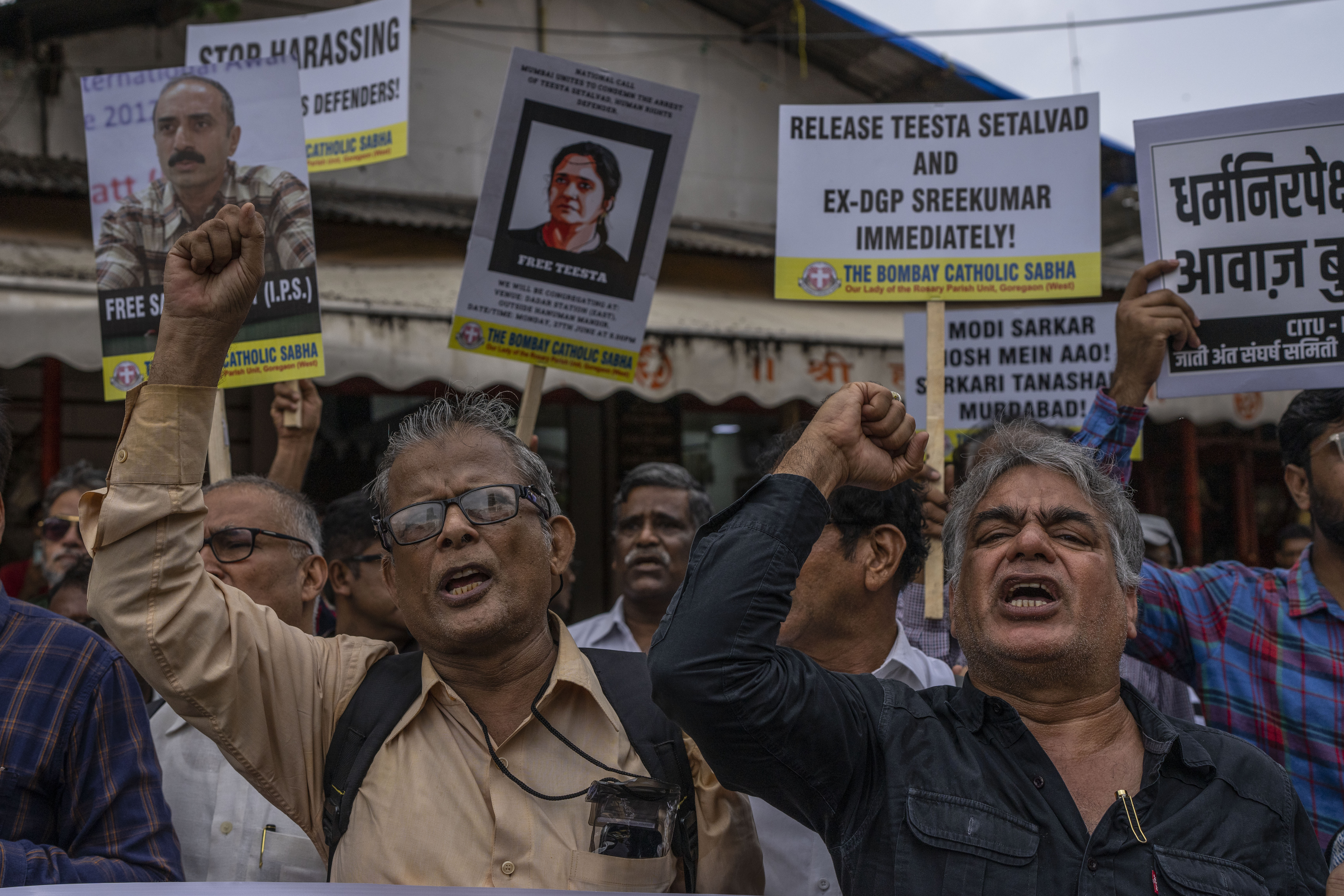 Supporters and activists shout slogans against Indian Prime Minister Narendra Modi.