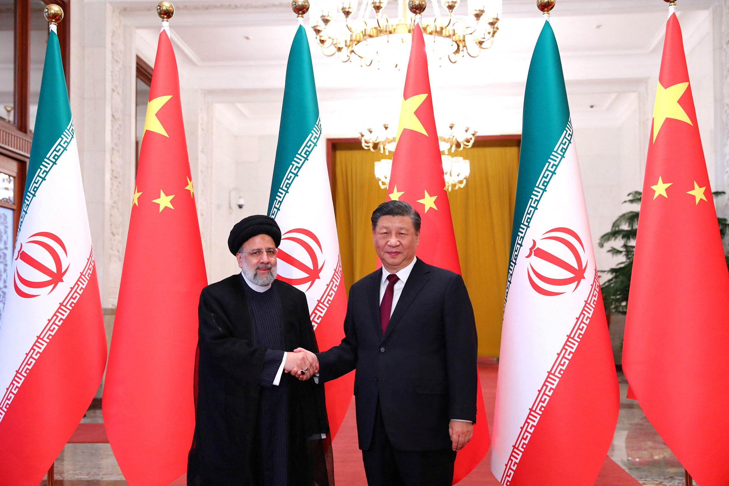 Iranian President Ebrahim Raisi shakes hands with Chinese President Xi Jinping during a welcoming ceremony in Beijing, China.