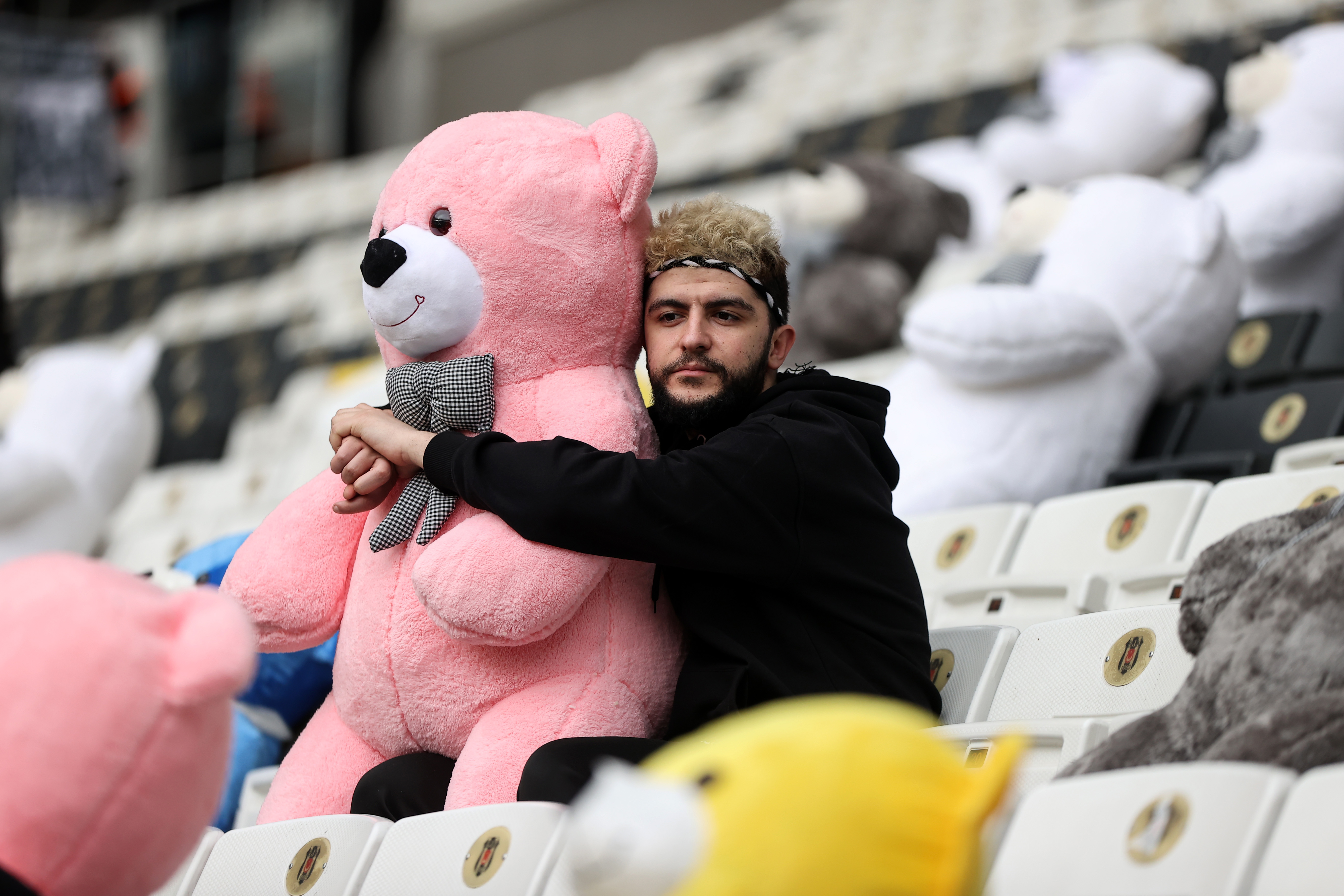 Fans throw toys onto the pitch during the Turkish Super League football match