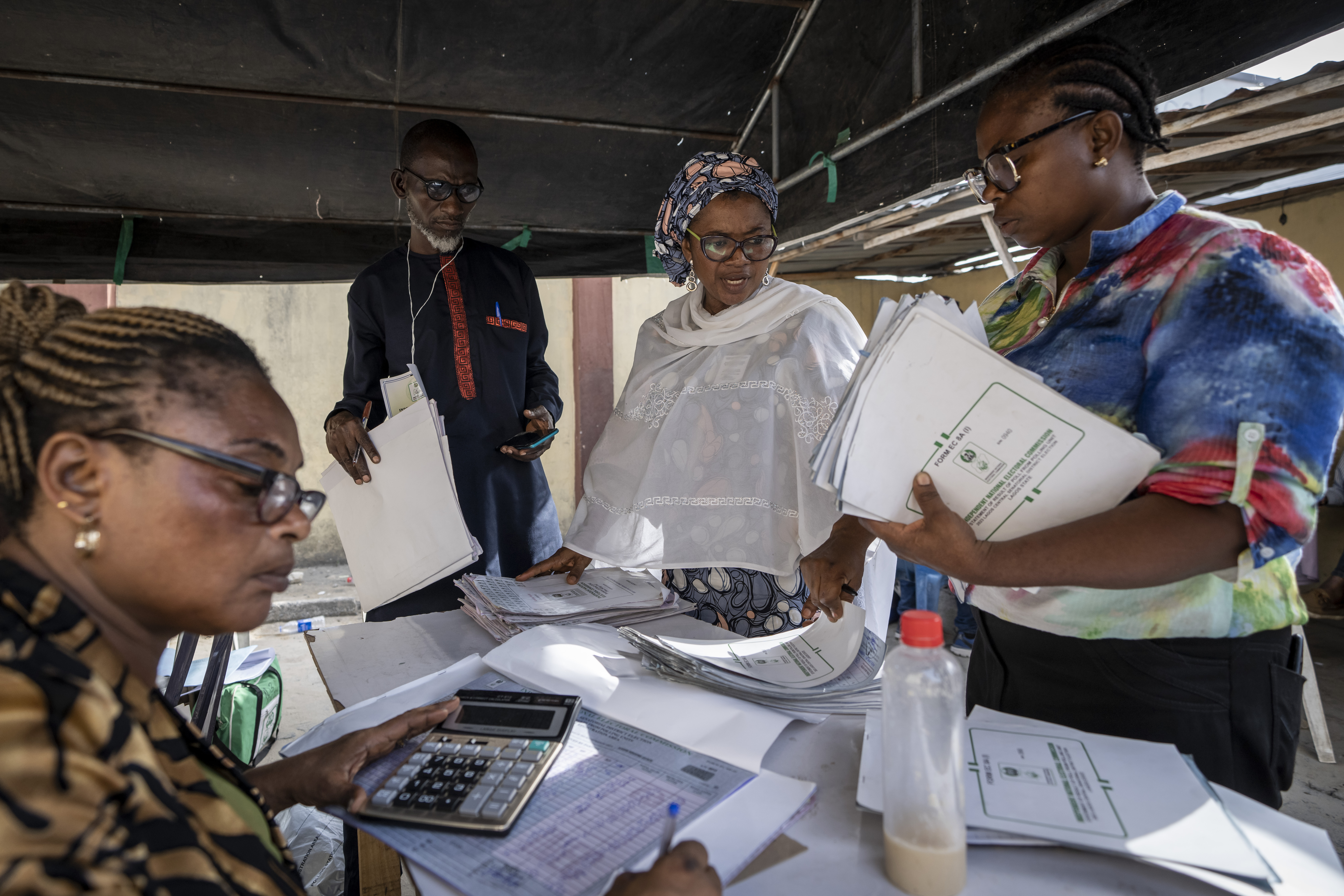 Electoral workers collate results manually at a centre in Lagos, Nigeria.