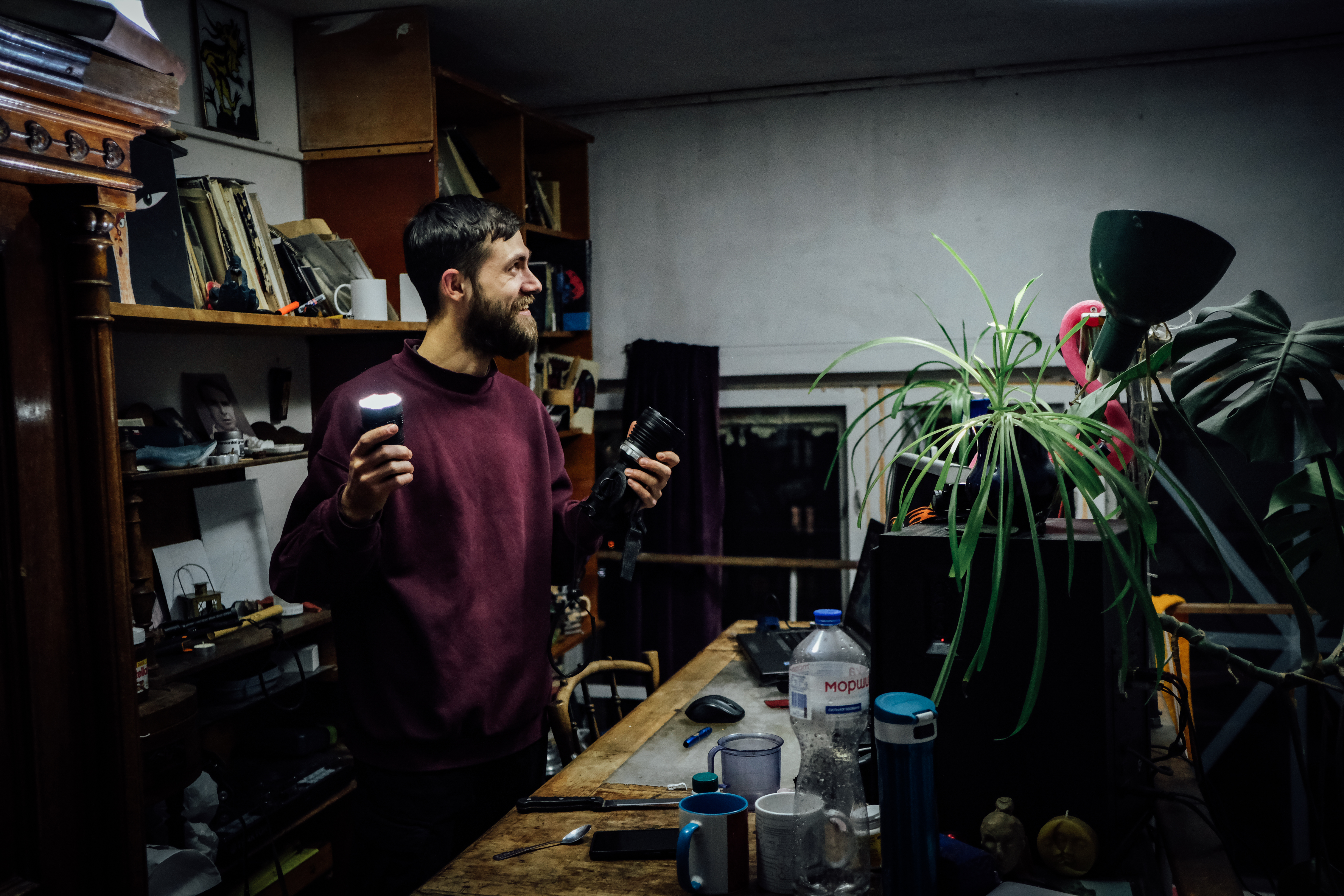 A photo of Nick Ivanov using his homemade lighting device.