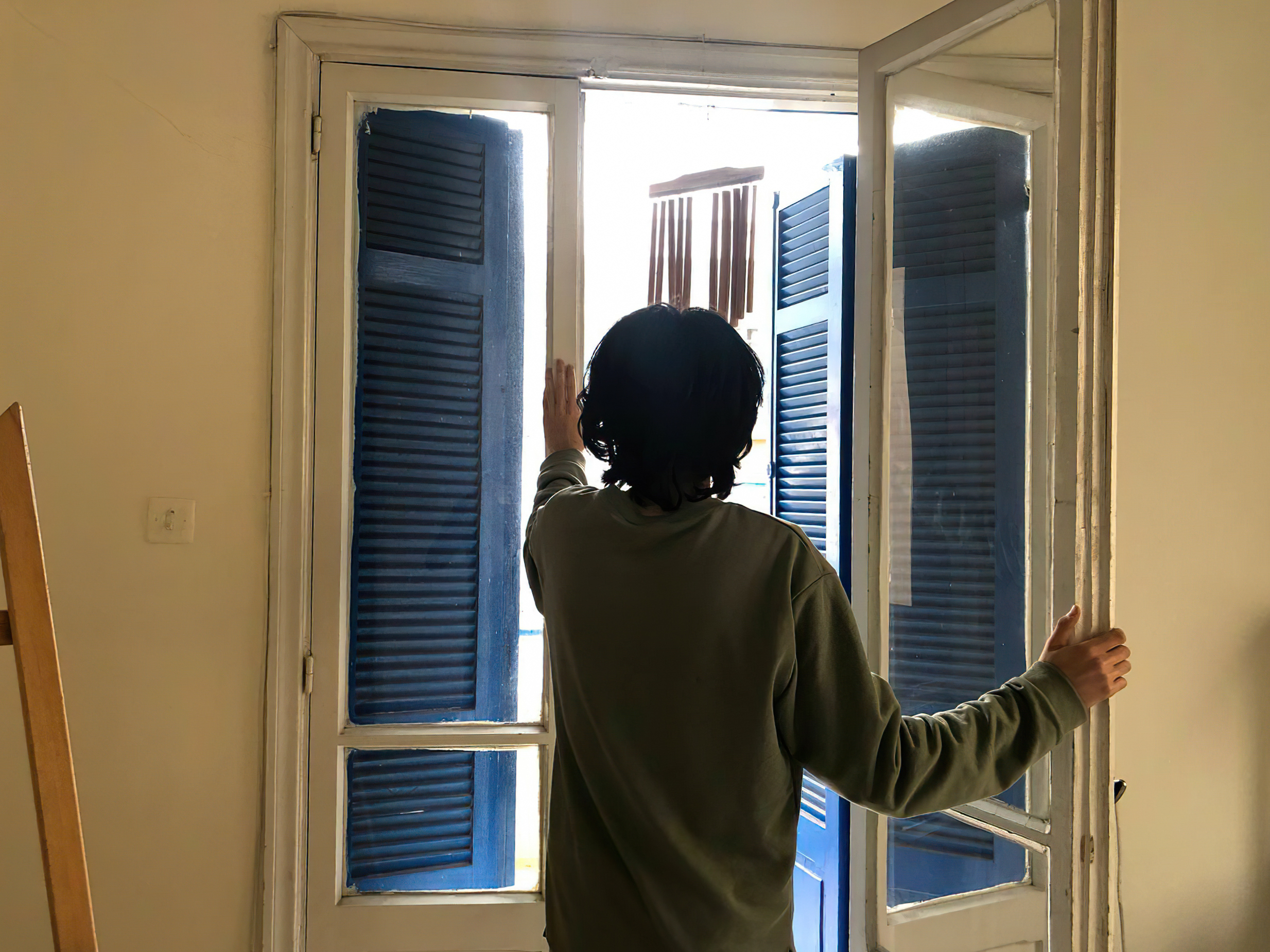 A photo of Ryan opening a door.