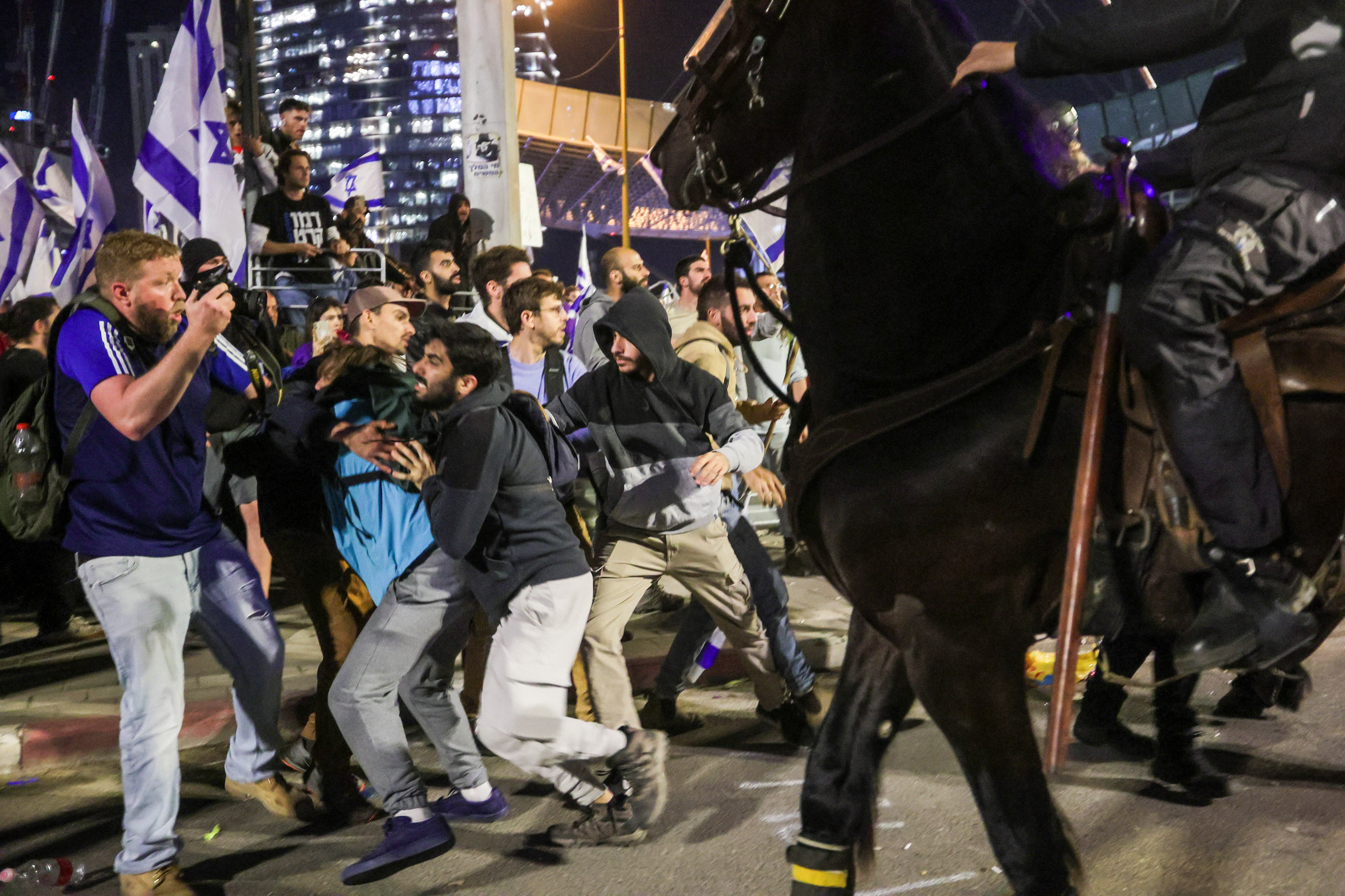 Protesters clash with police at a demonstration in Tel Aviv, Israel.