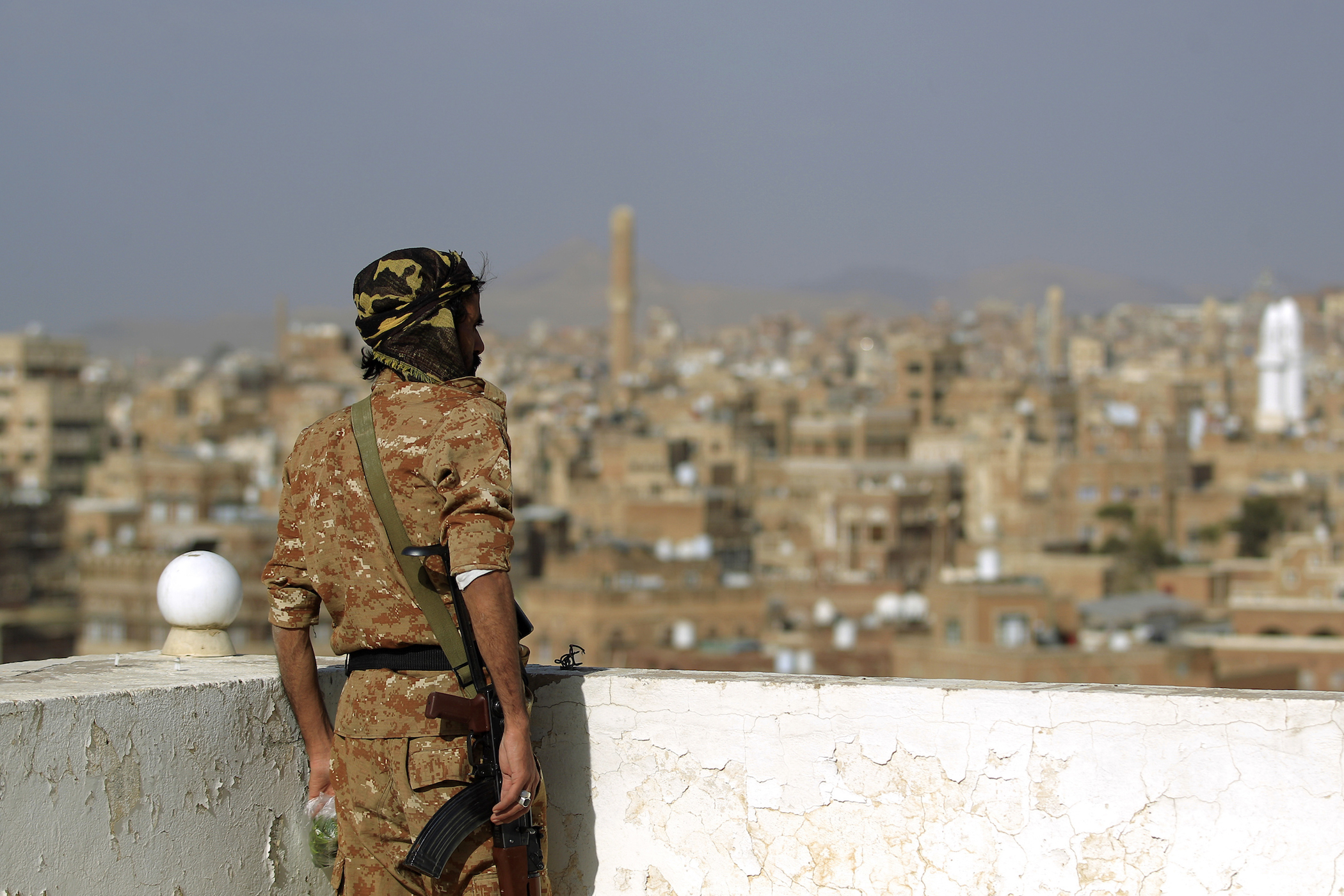 A member of Huthi-affiliated security forces looks on in the old city of the rebel-held Yemeni capital Sanaa