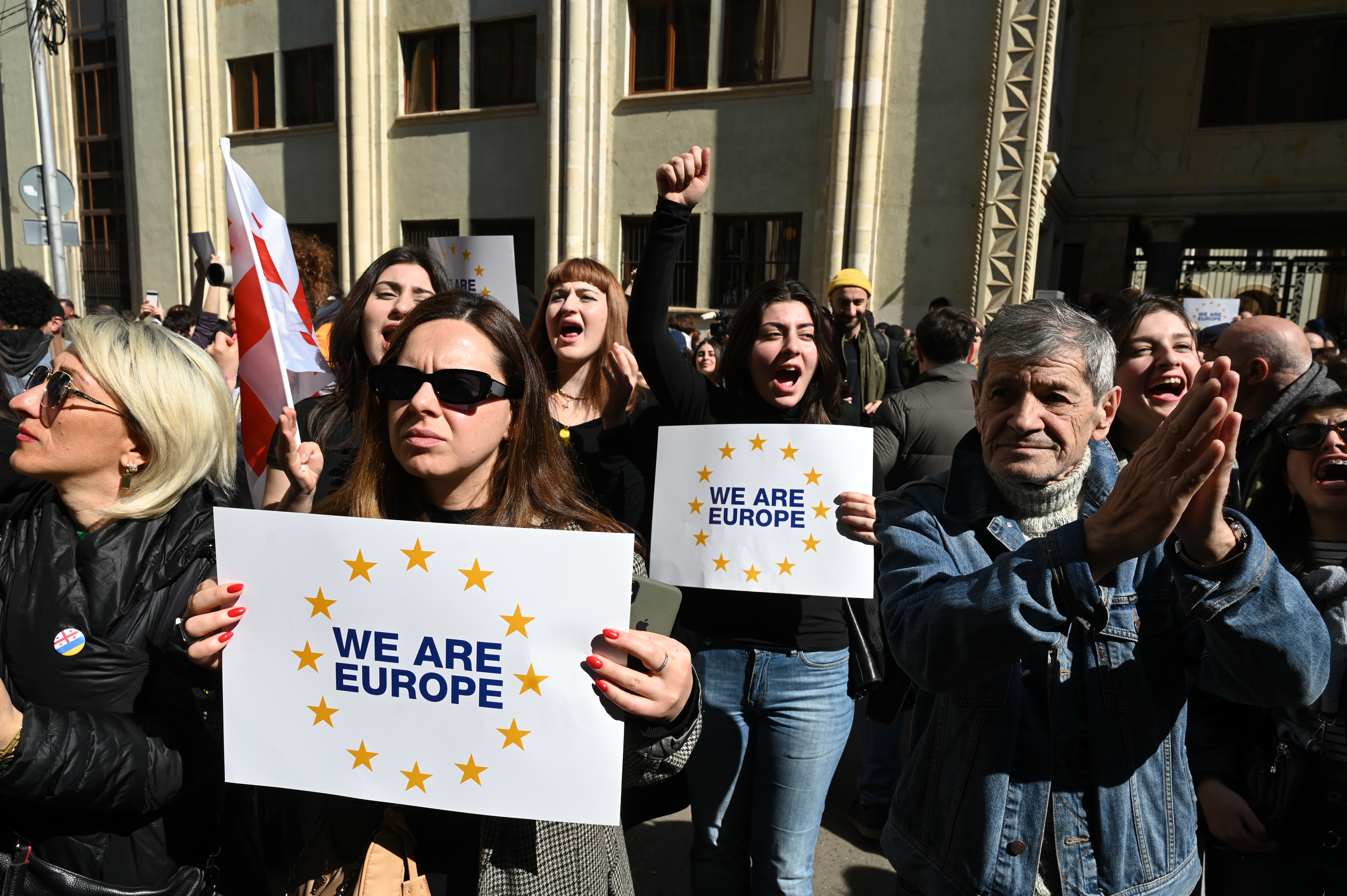 Georgian anti-government protesters rally outside the parliament