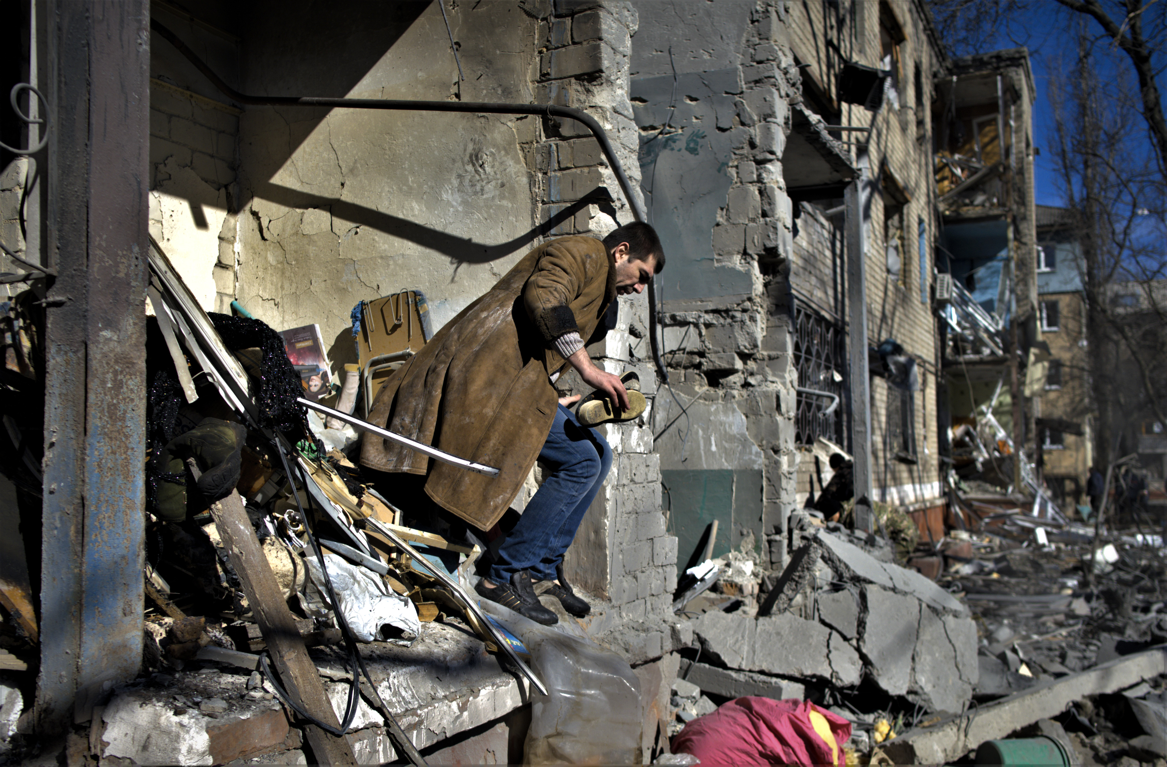 A resident looks for his belongings after a shelling in Kramatorsk, eastern Ukraine.