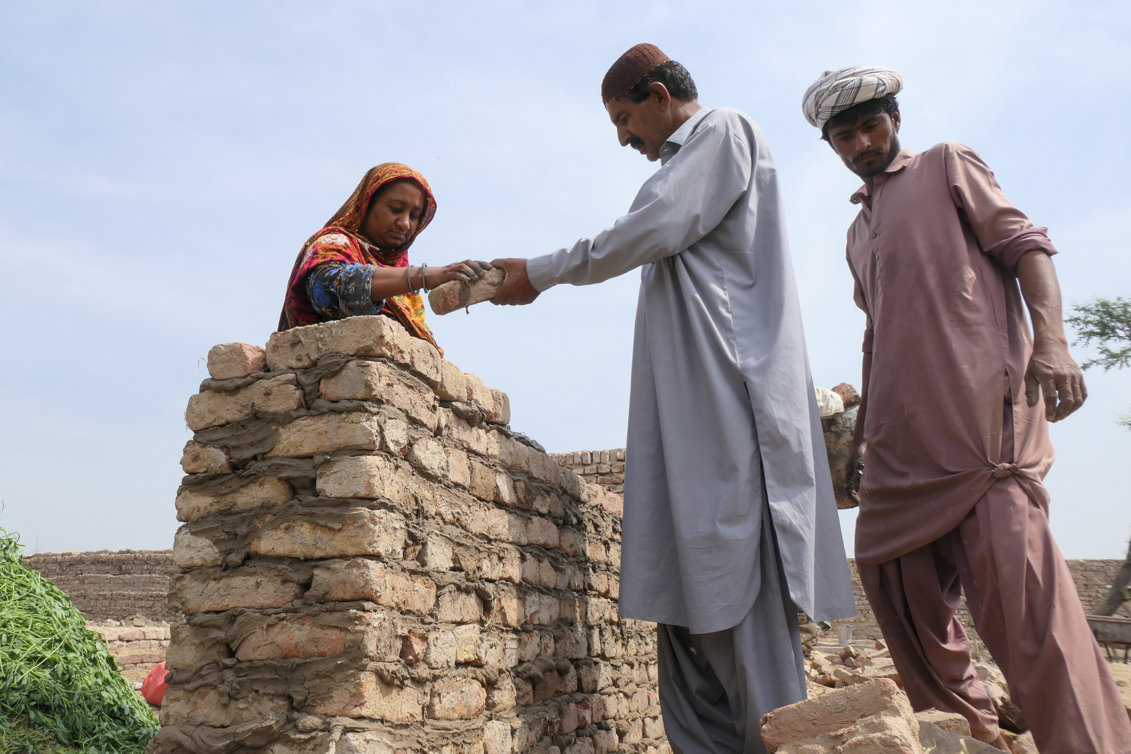 Seema Chandio building her house with her husband Mustafa Ali