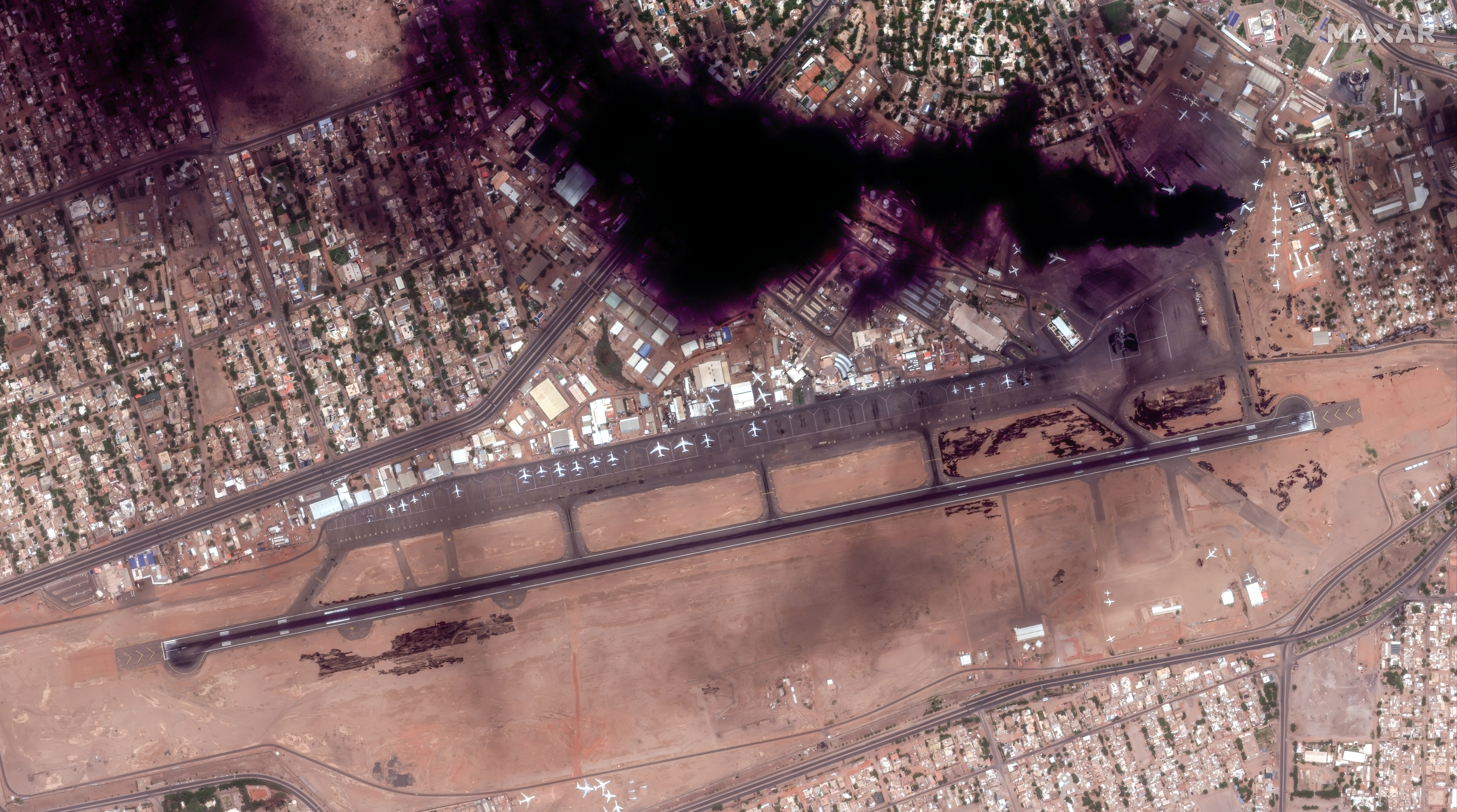 satellite image shows smoke over Khartoum International Airport