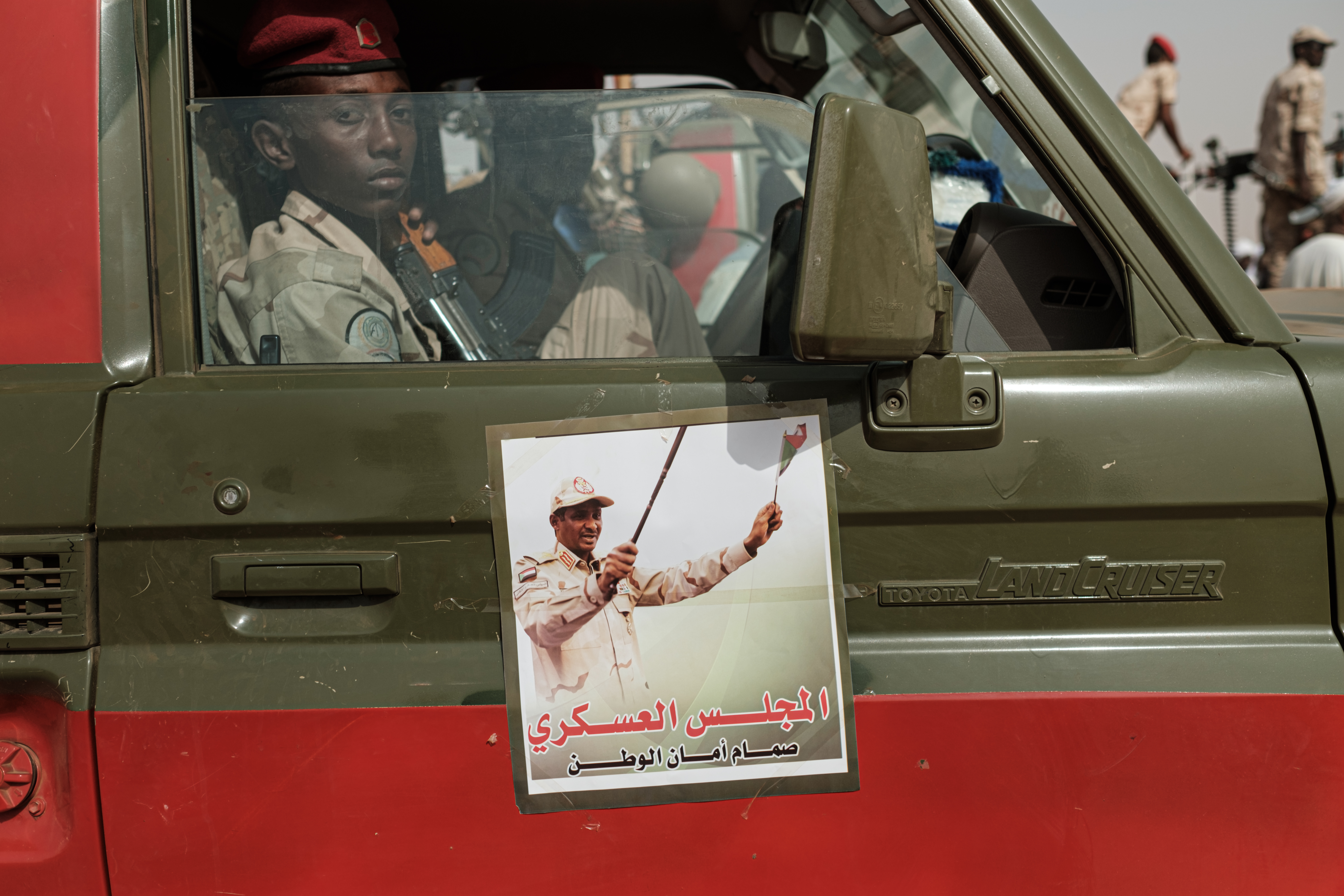 A portrait of Mohamed Hamdan Dagalo, known as Himediti, deputy head of Sudan's ruling Transitional Military Council (TMC) and commander of the Rapid Support Forces (RSF) paramilitaries, is seen on a door of an RSF vehicle before a rally in the village of Abraq