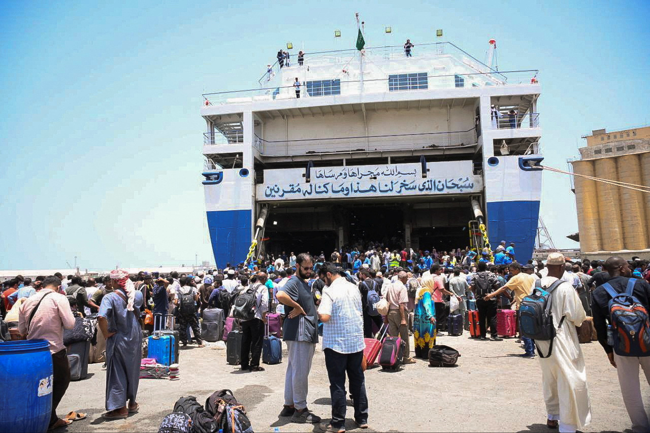 People prepare to board a boat