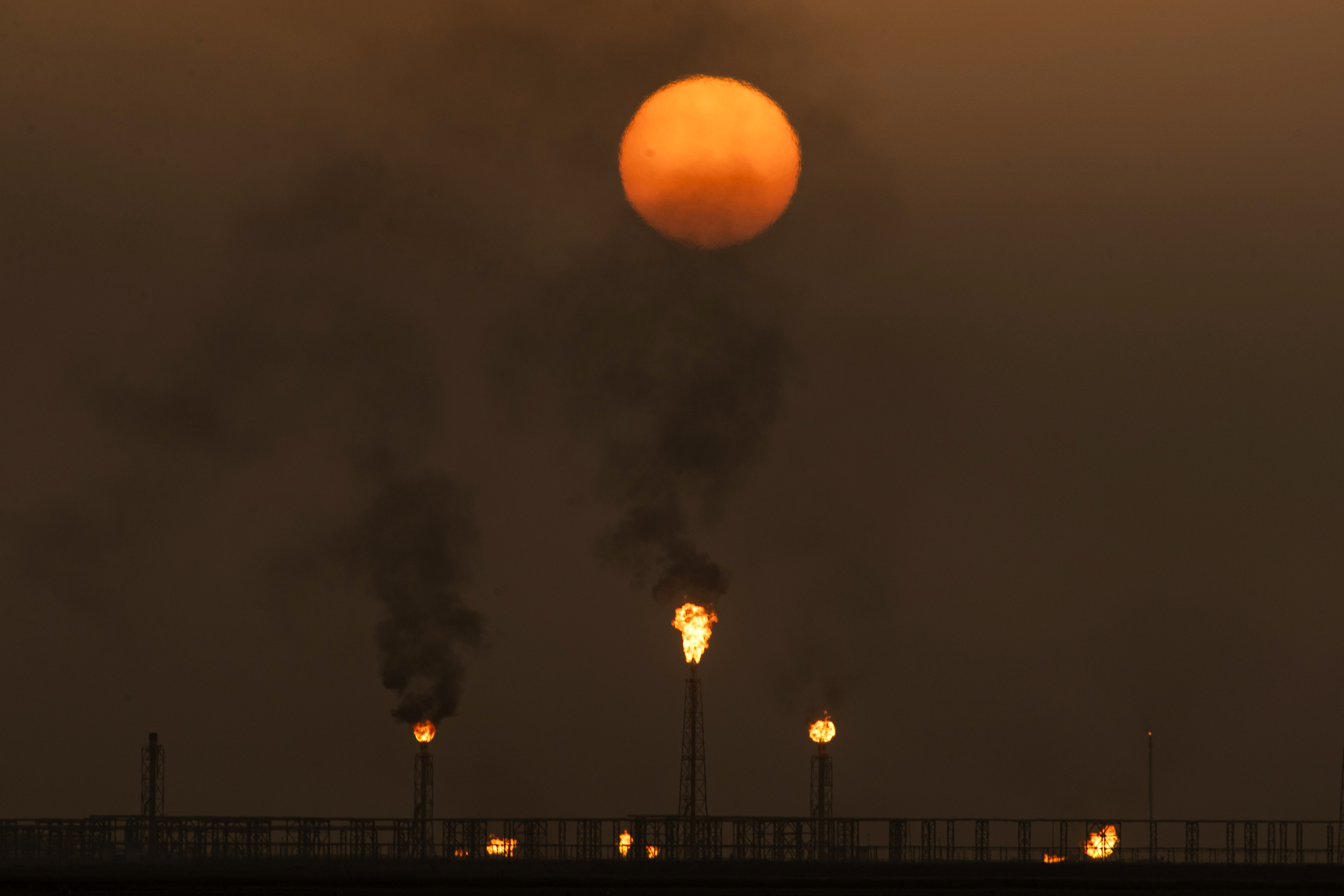 Flaring is the process of burning off petroleum gas by setting alight any excess in a jet of fire [File: Hussein Faleh/AFP]