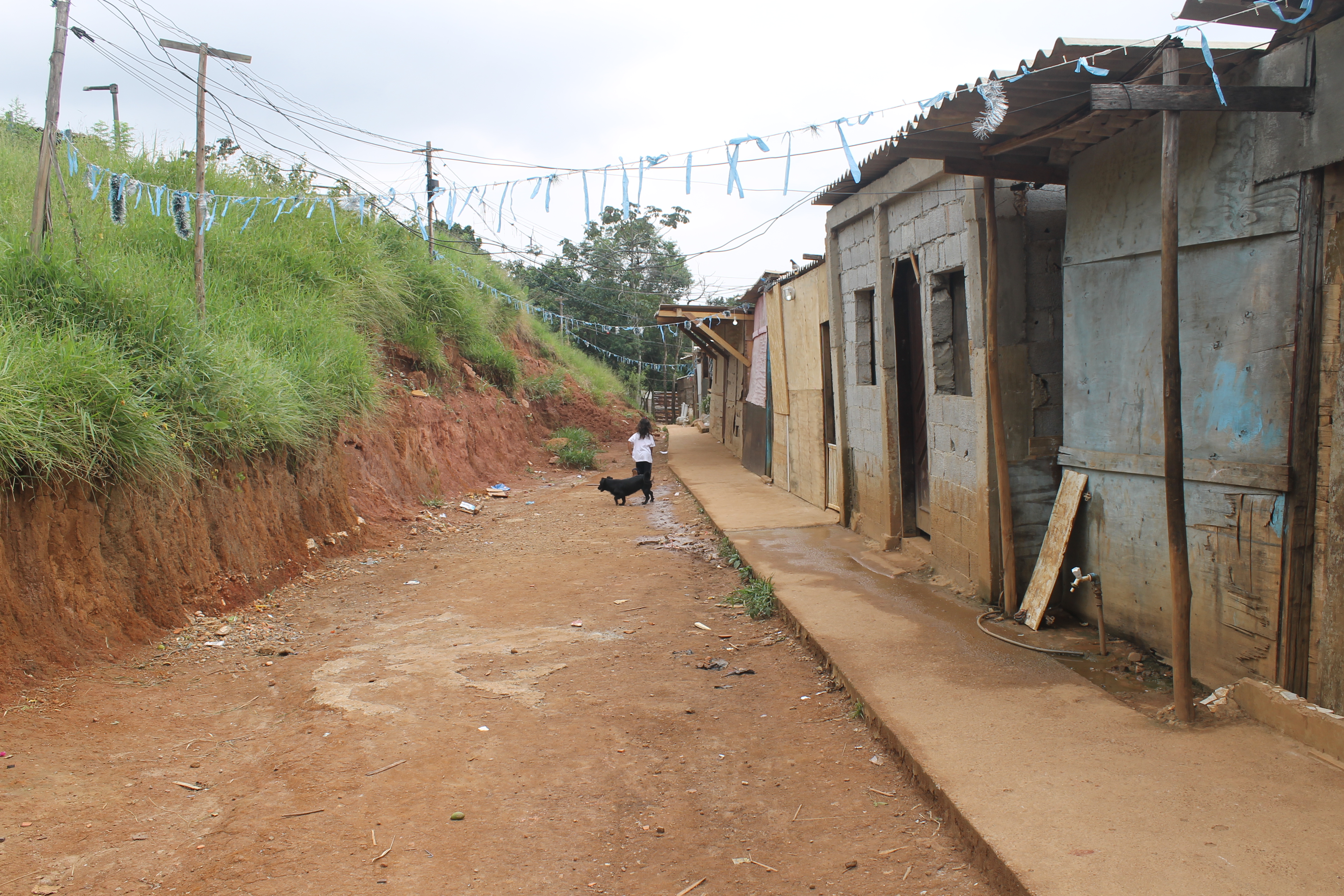 A girl runs through the squatters' settlement of 'Veneza City' in Brazil