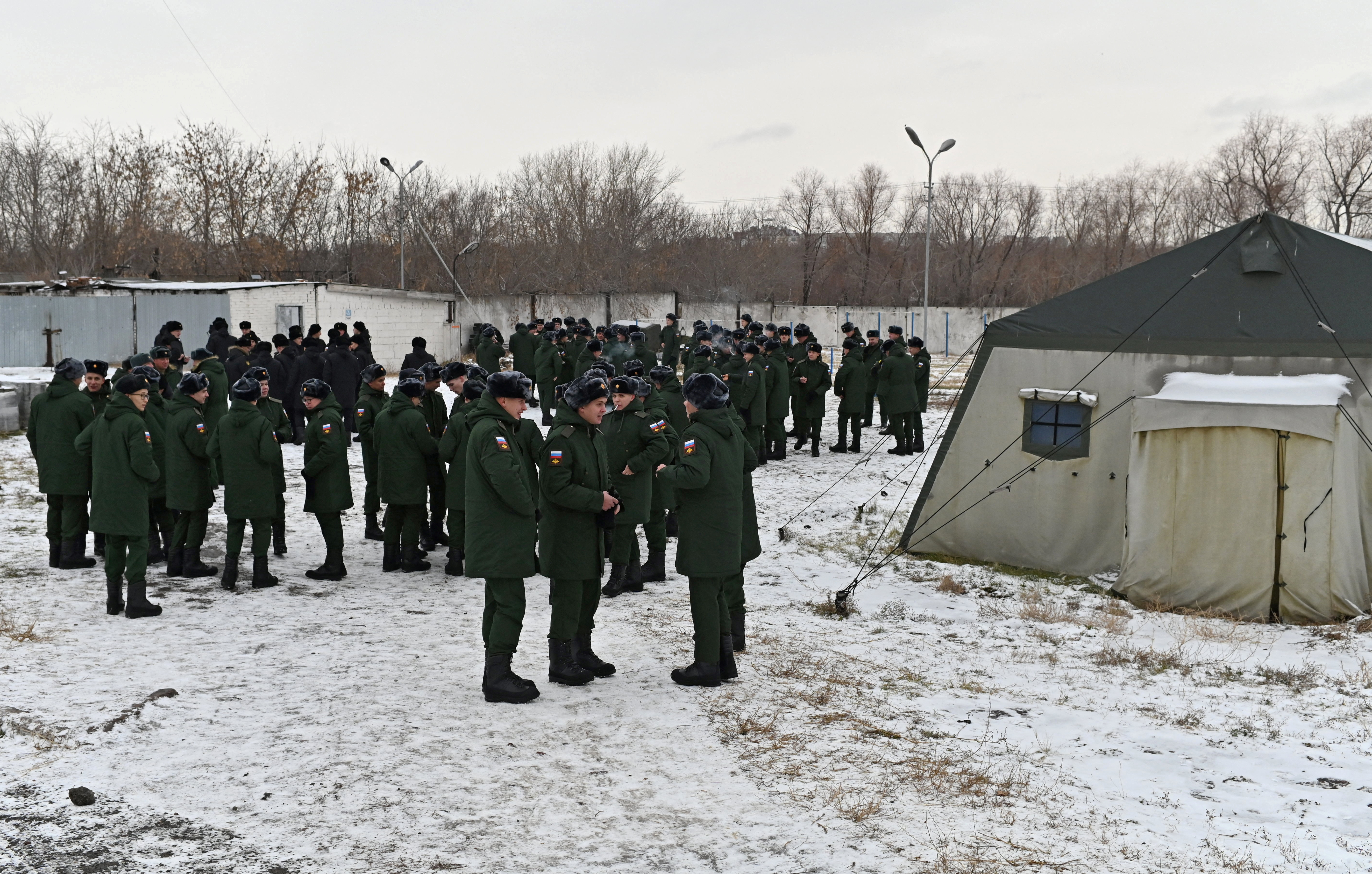 Russian conscripts called up for military service during the annual autumn draft meet at a gathering point before their departure for garrisons, in Omsk, Russia.