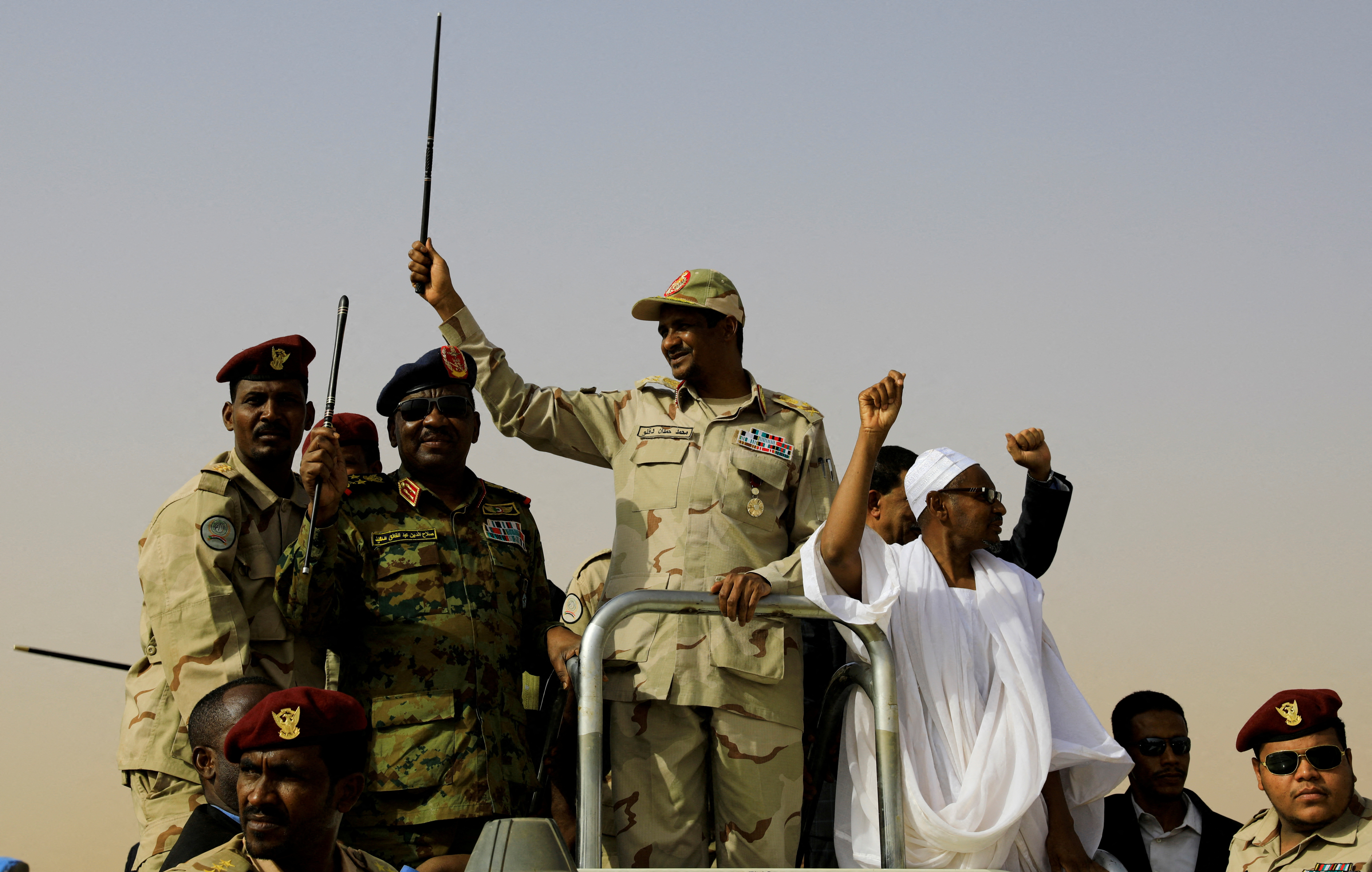 FILE PHOTO: Lieutenant General Mohamed Hamdan Dagalo, deputy head of the military council and head of paramilitary Rapid Support Forces (RSF), greets his supporters as he arrives at a meeting in Aprag village, 60 kilometers away from Khartoum, Sudan, June 22, 2019. REUTERS/Umit Bektas/File Photo