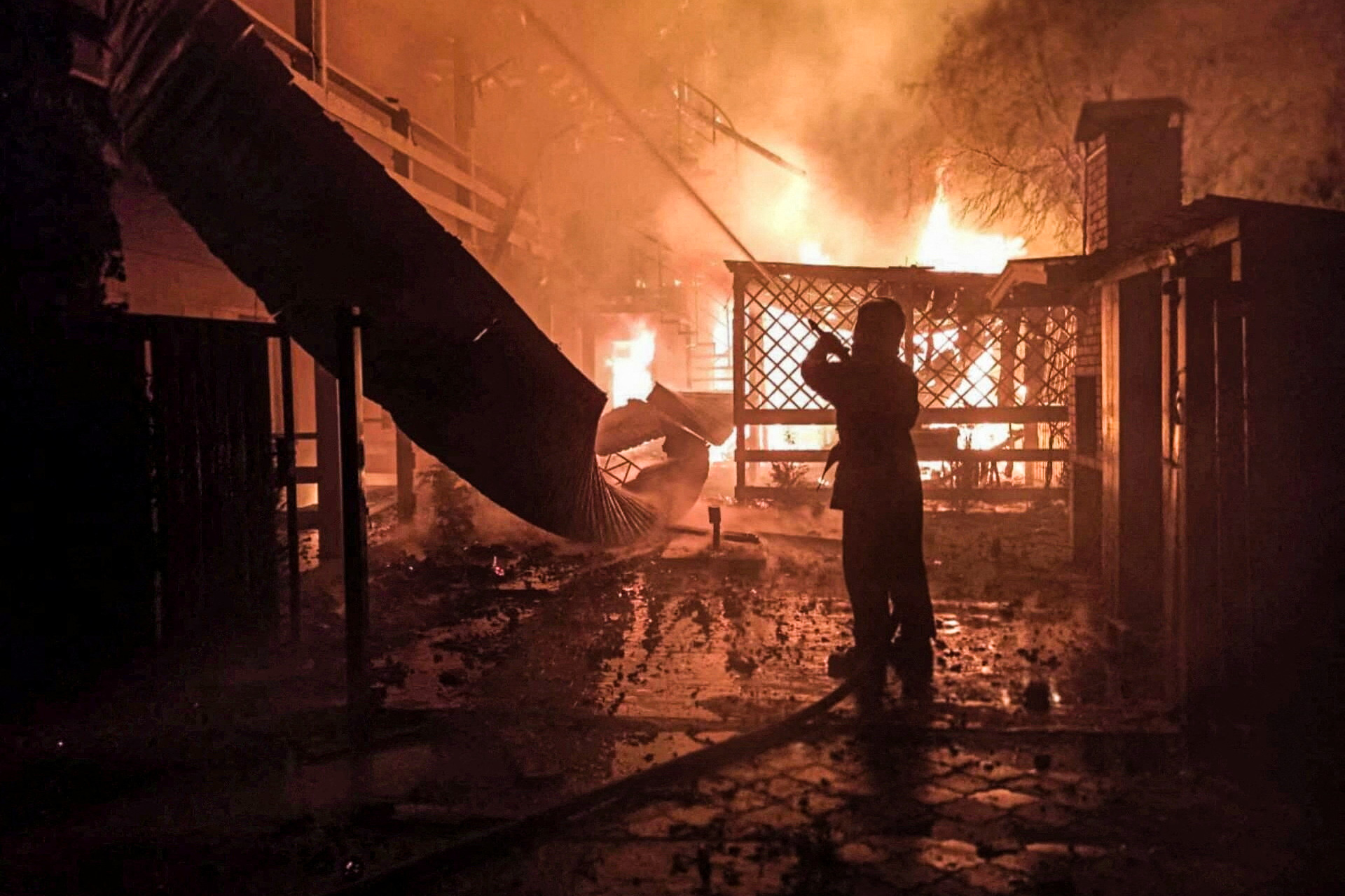 A firefighter works at the site of a resort area hit by a Russian missile strike, amid Russia's attack on Ukraine