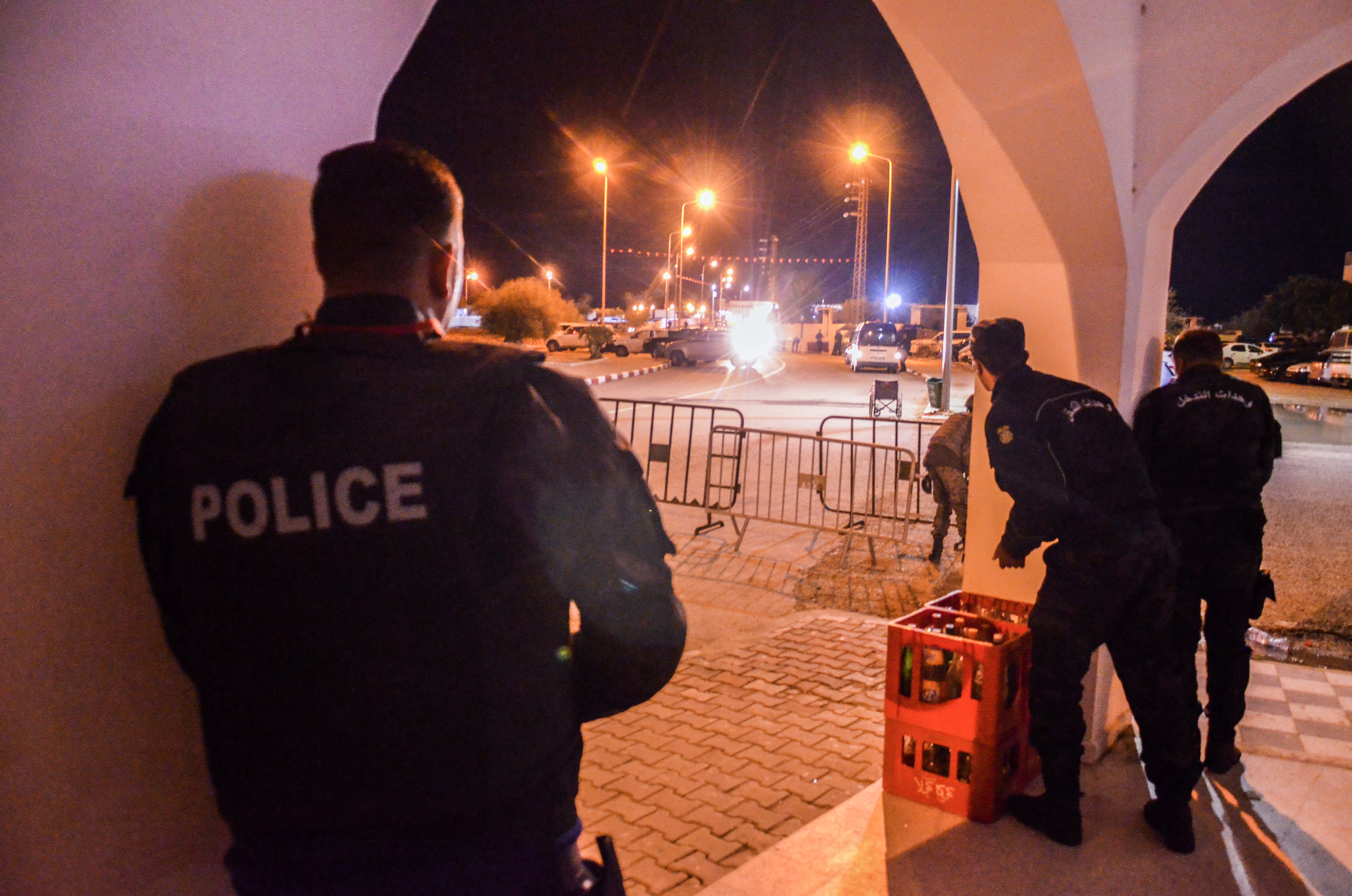 police take positions near the Ghriba synagogue during a shootout on the resort island of Djerba.