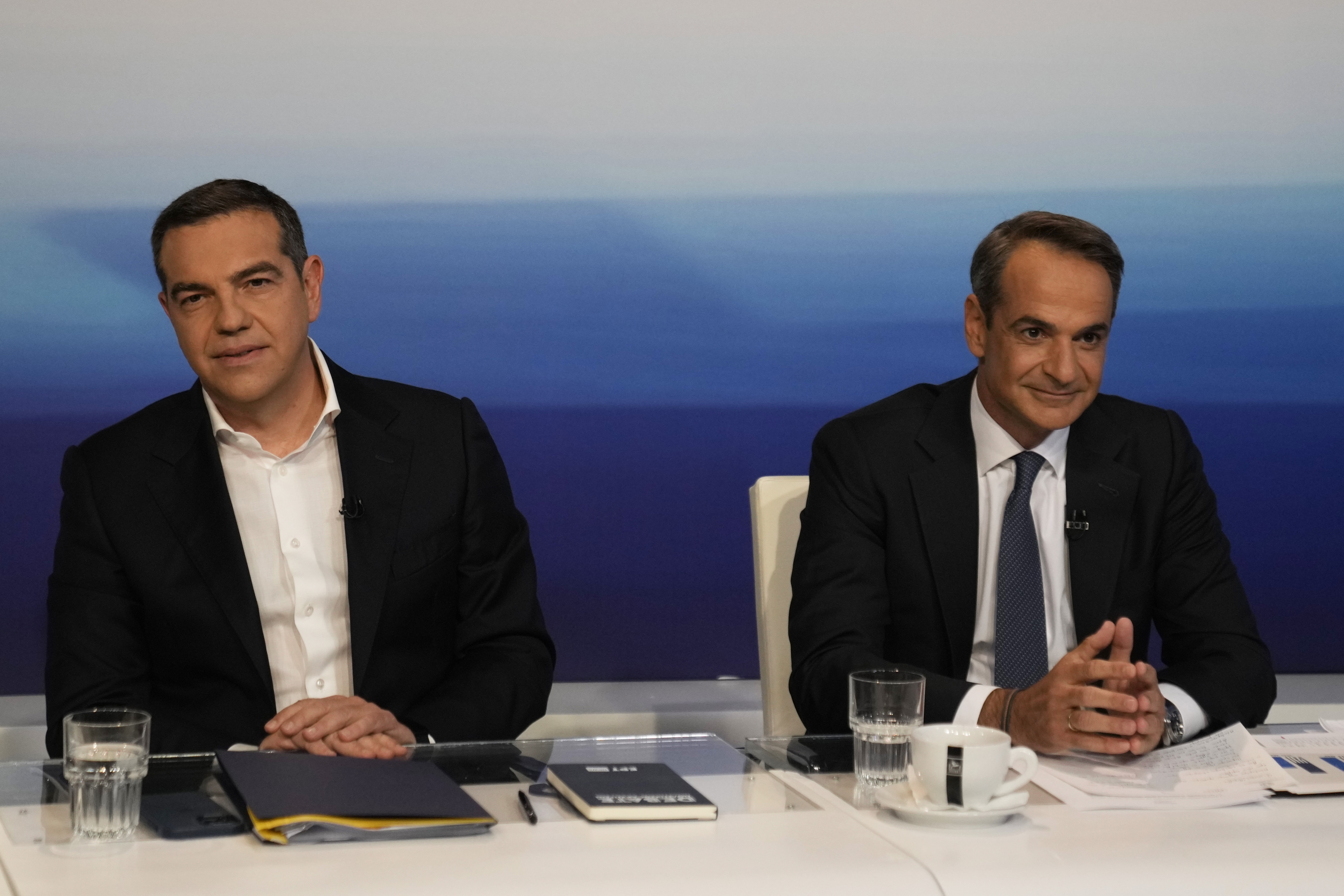 Greece's Prime Minister and New Democracy leader Kyriakos Mitsotakis, right, and leader of the main opposition Syriza party, Alexis Tsipras
