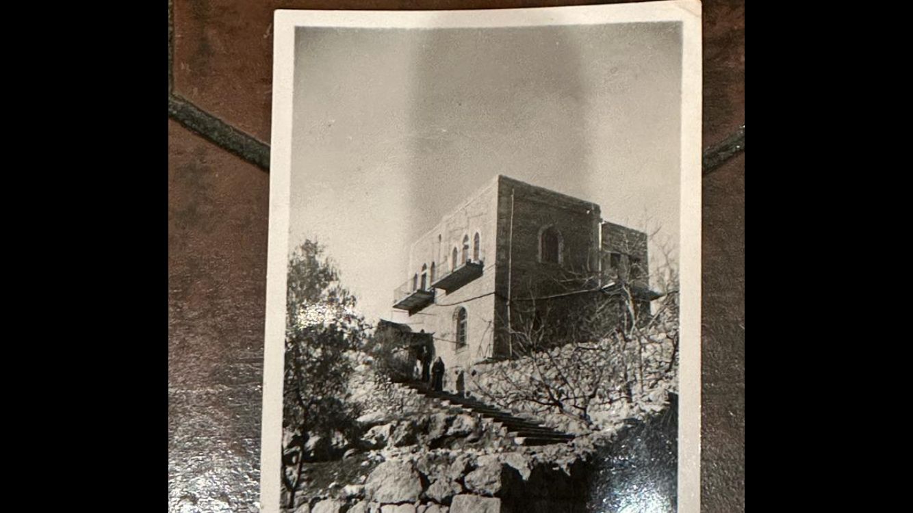 A black and white photo of Leila's childhood home