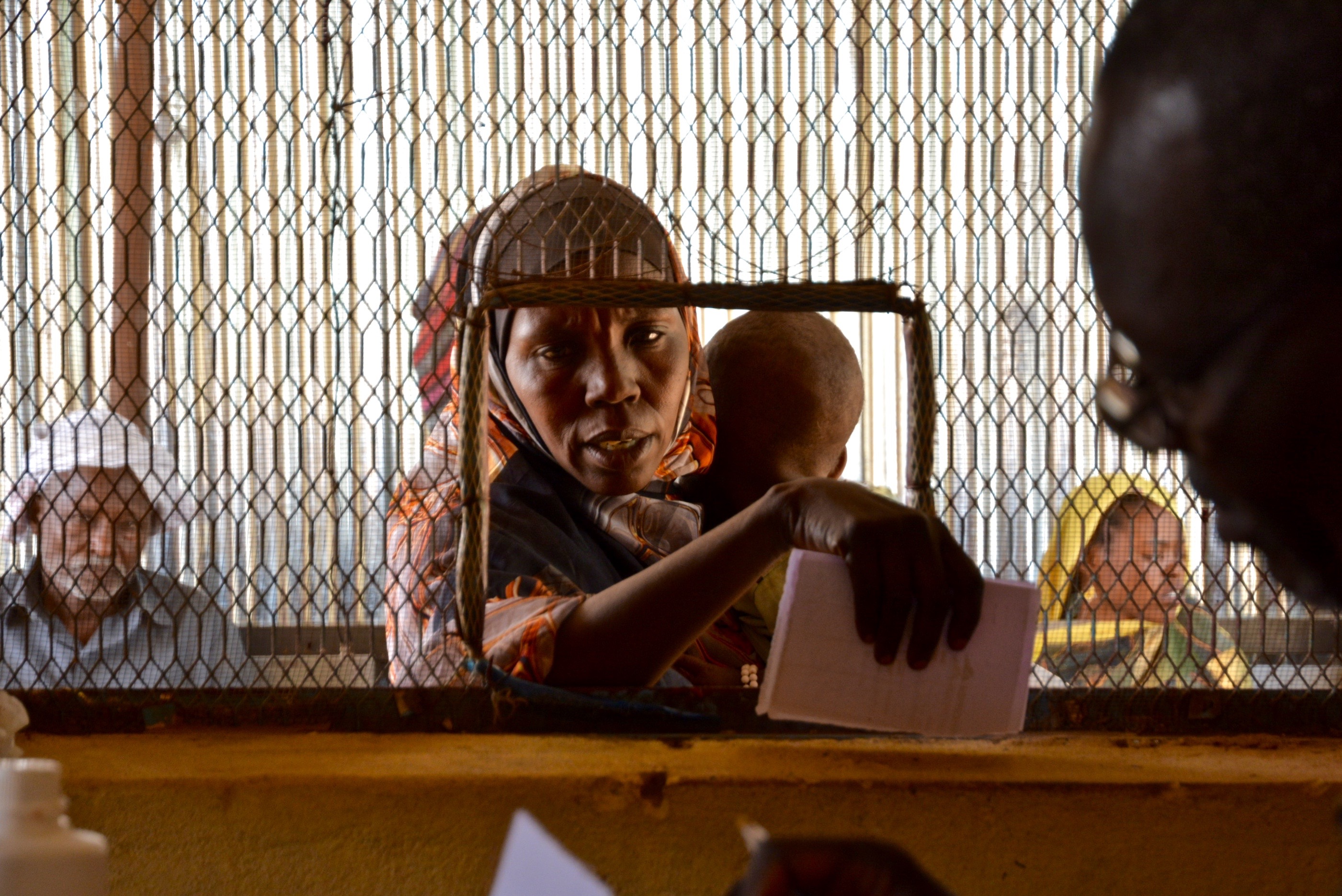 A woman and her child at a health centre in Sudan