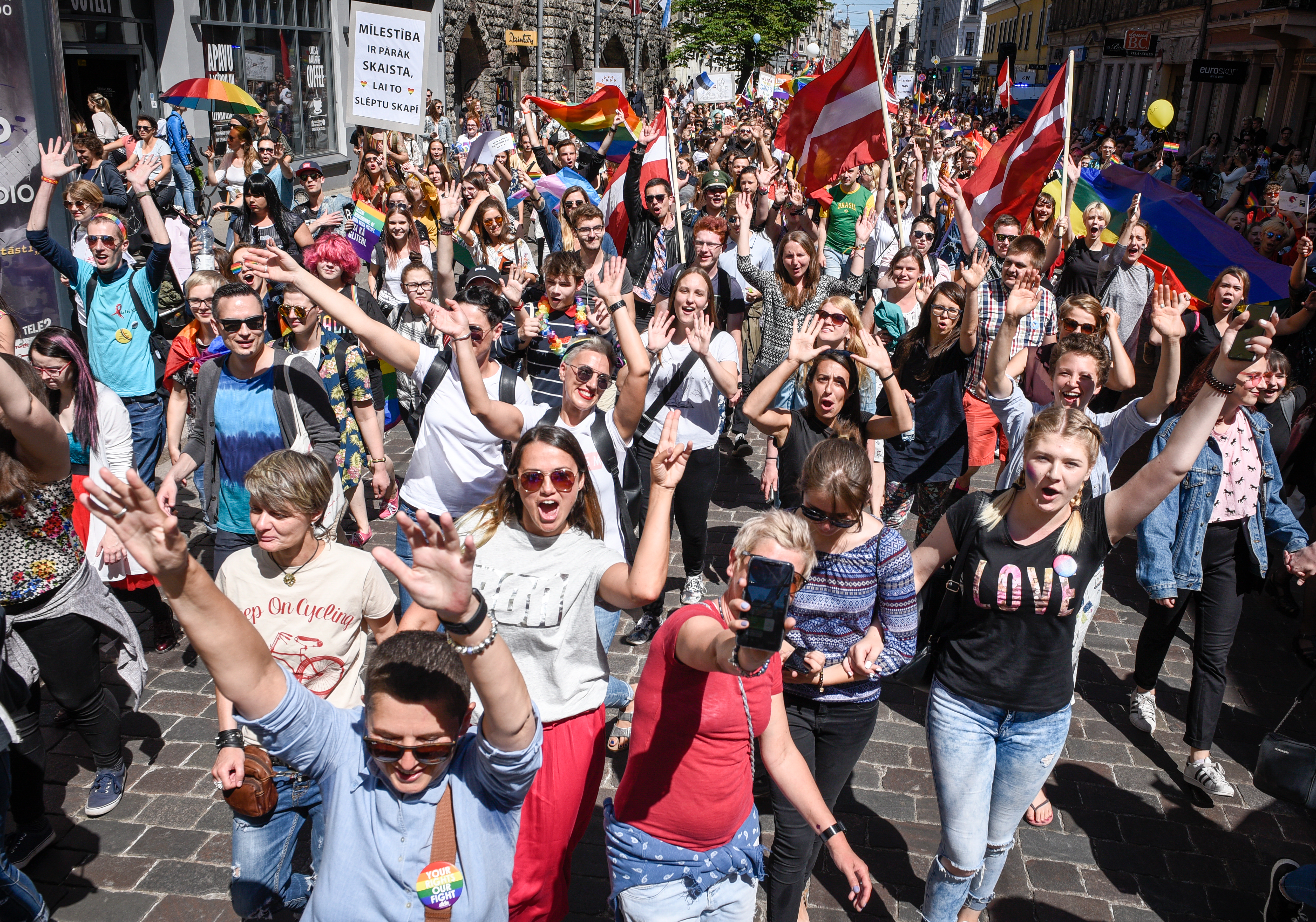 Revellers take part in Baltic gay pride parade in Riga, Latvia