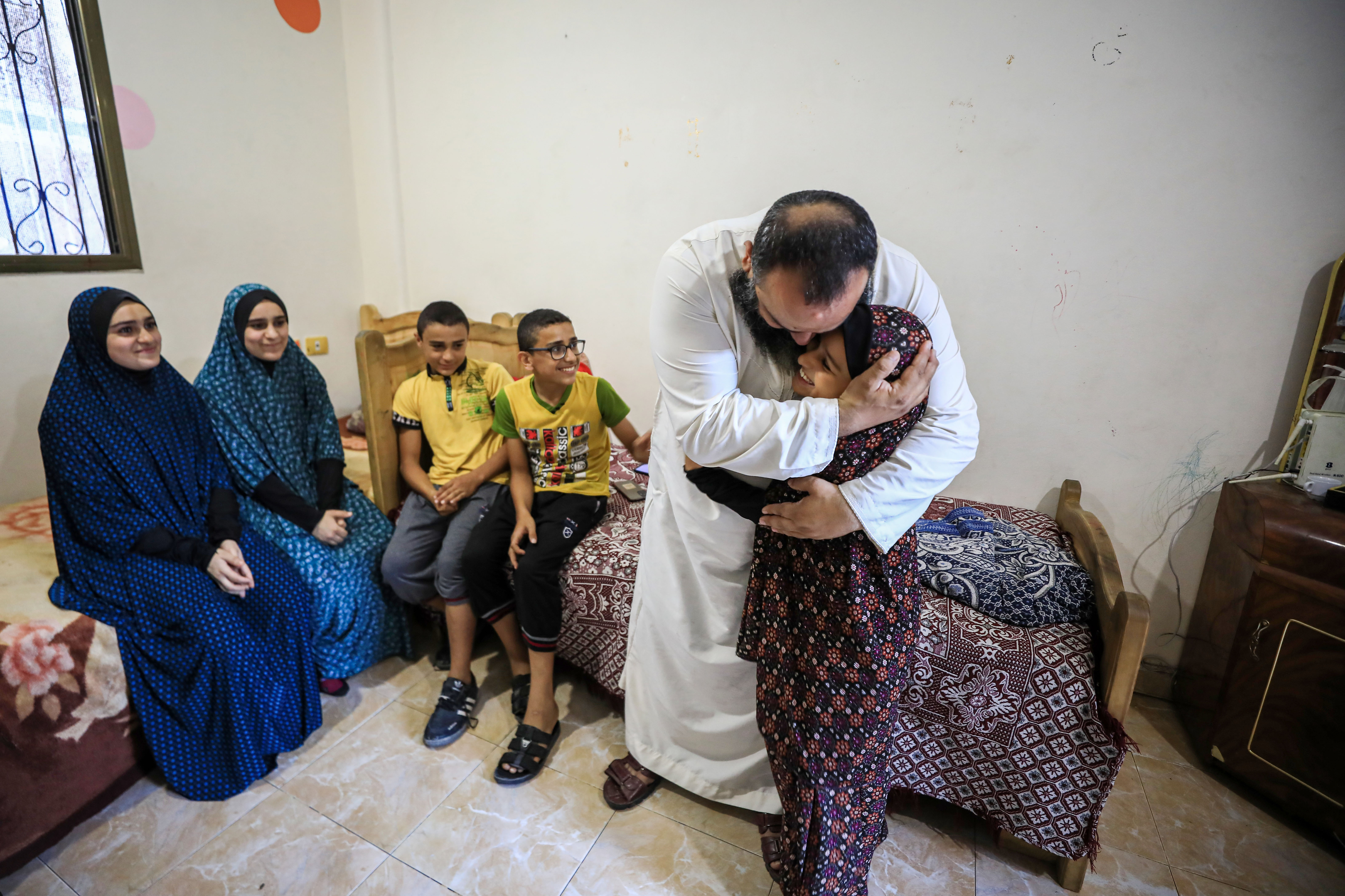 A man bids farewell to his family