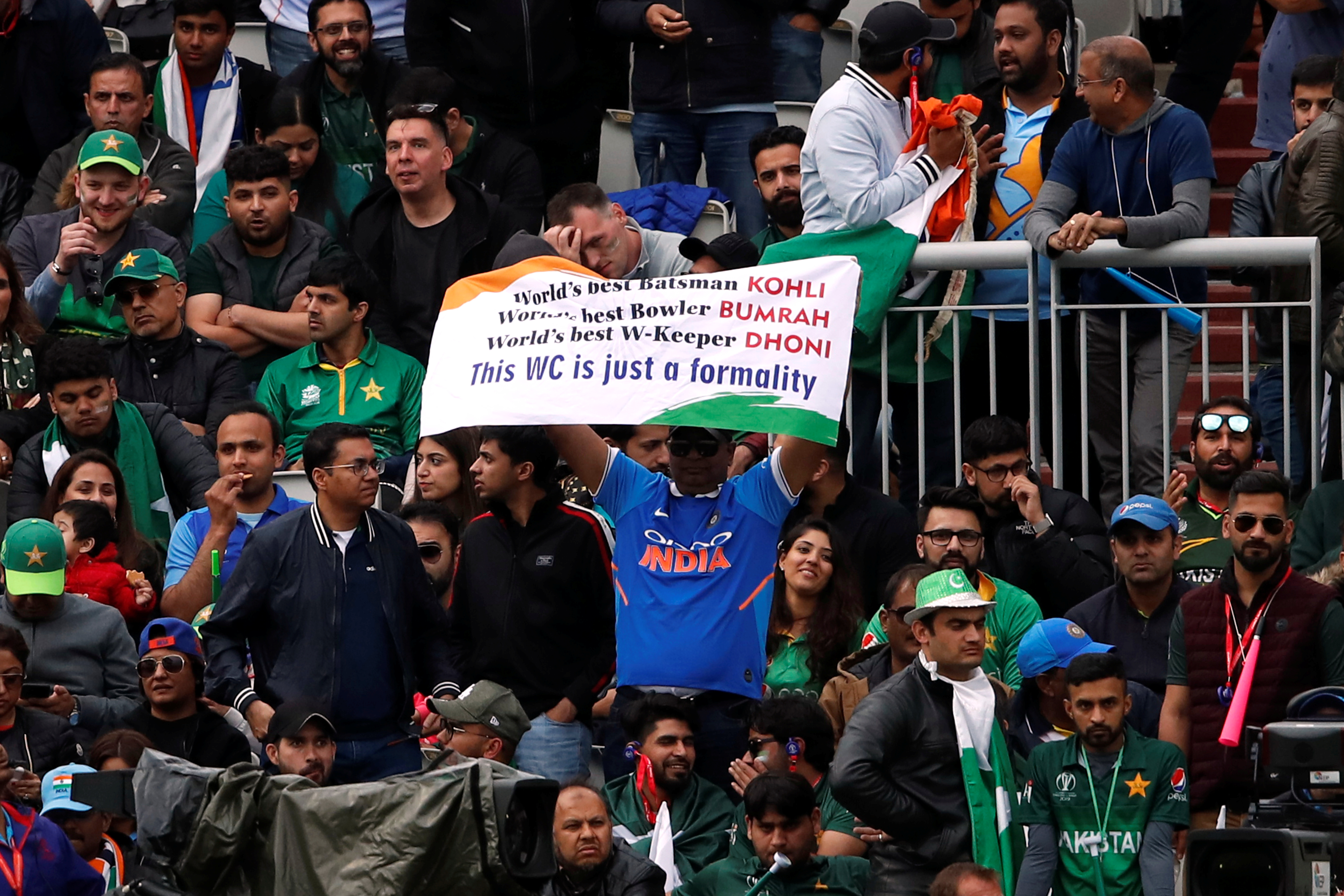 An India fan holds up a banner during the match 