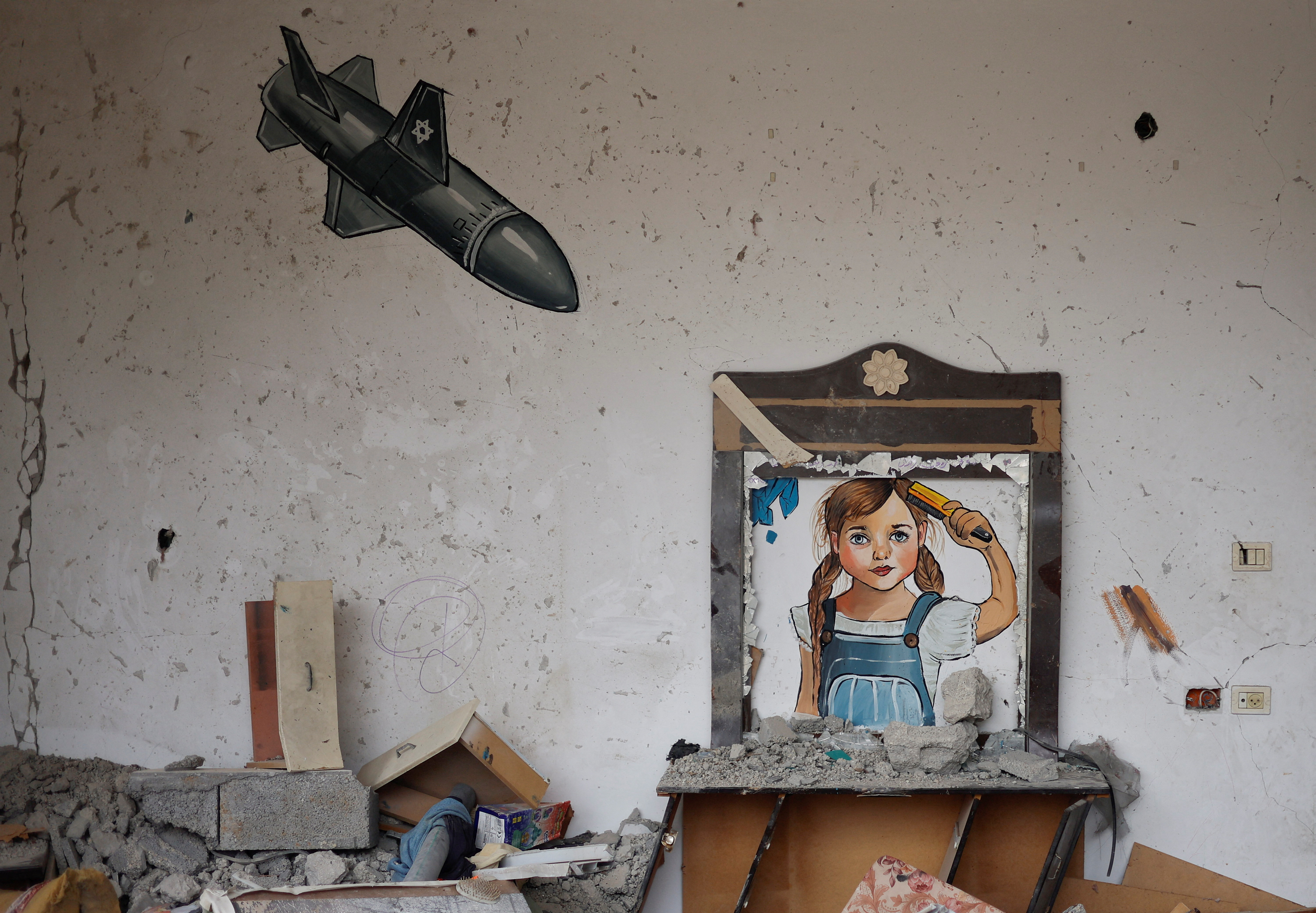 A painting drawn by artists is seen at a house destroyed by Israel, in recent Israeli-Gaza fighting, in Deir Al-Balah, central Gaza Strip June 13, 2023. REUTERS/Mohammed Salem