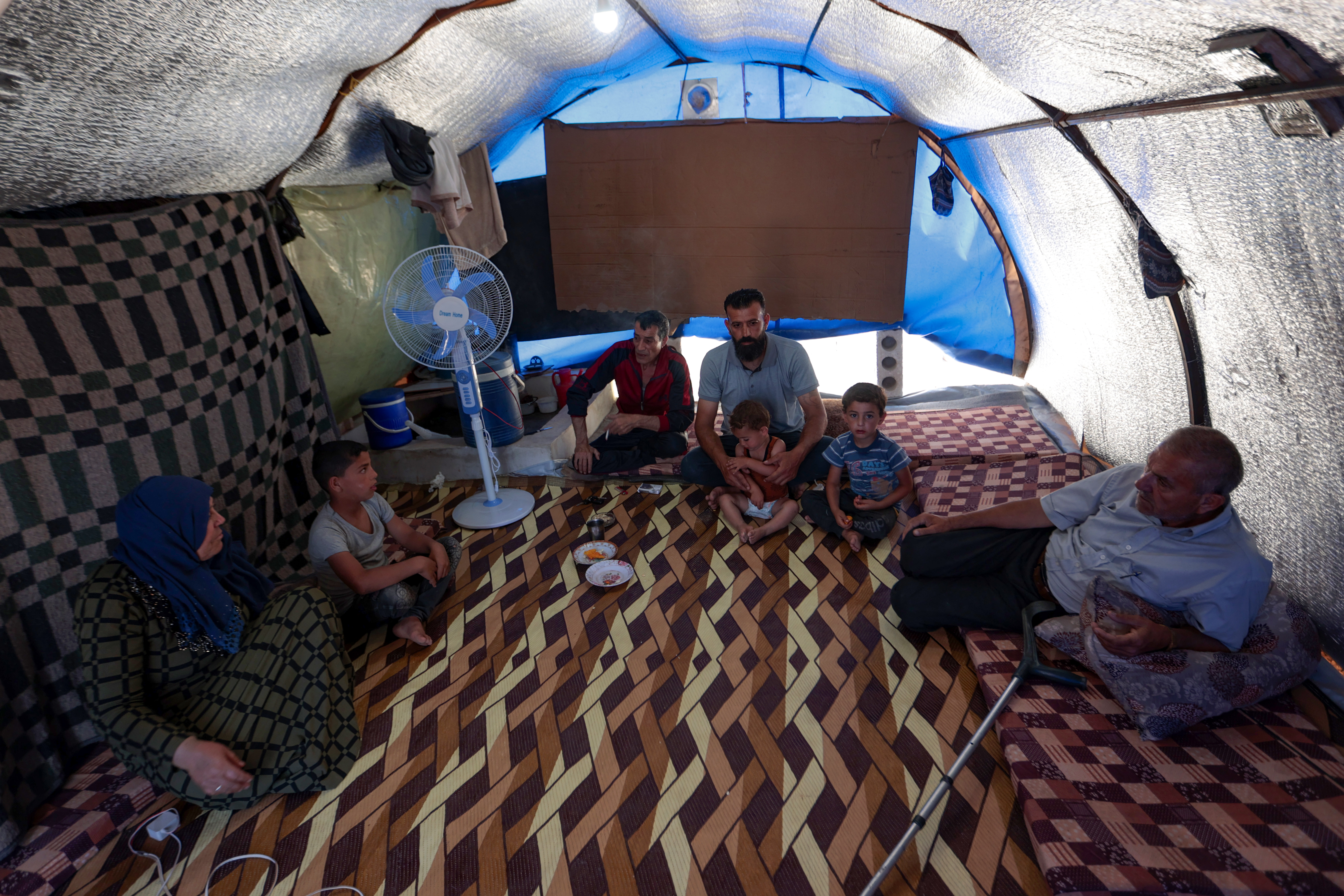 people sit on a carpet made of recycled plastic,