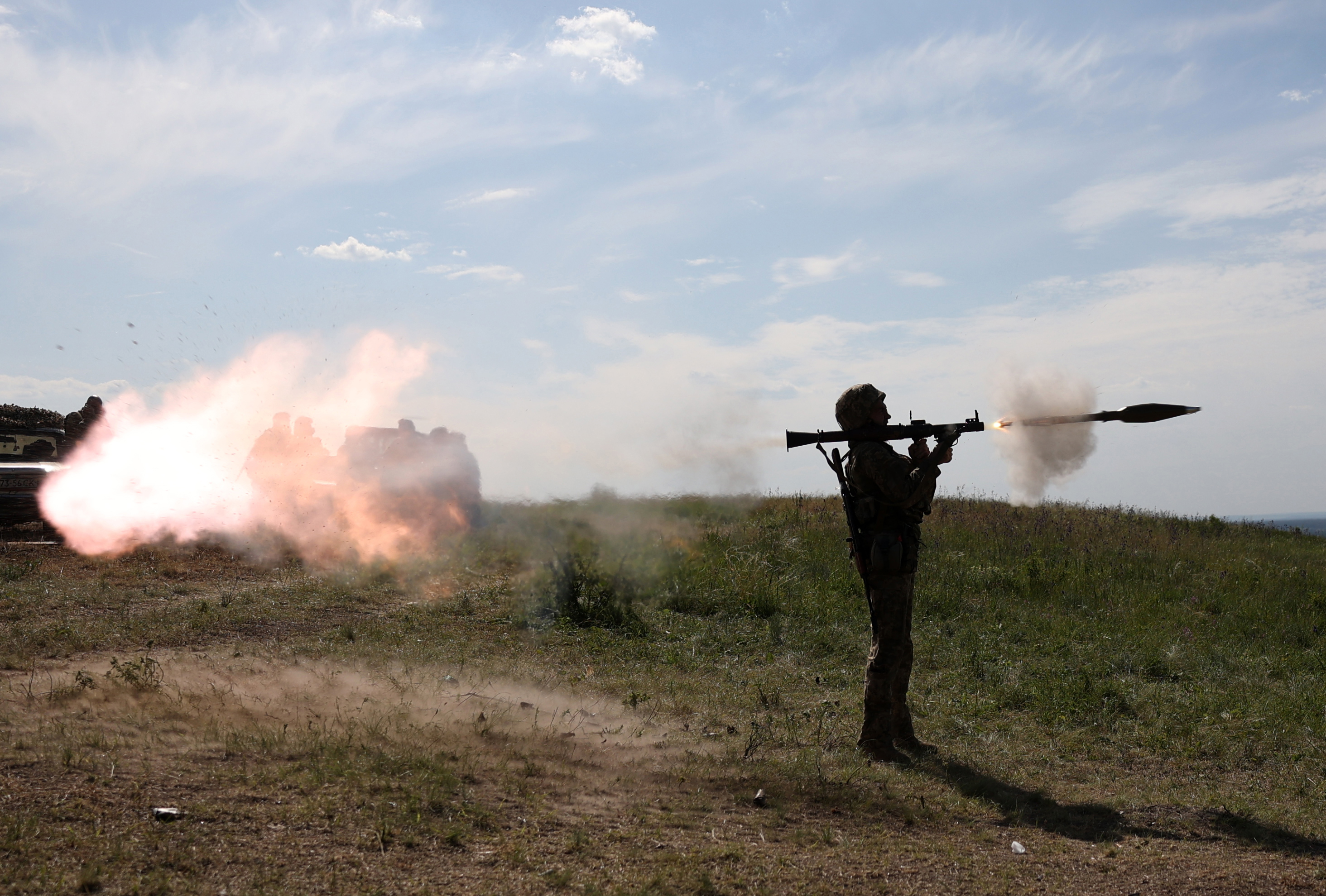 A Ukrainian serviceman fires a rocket launcher during a military training exercise not far from front line in Donetsk region on June 8, 2023. (Photo by Anatolii Stepanov / AFP)