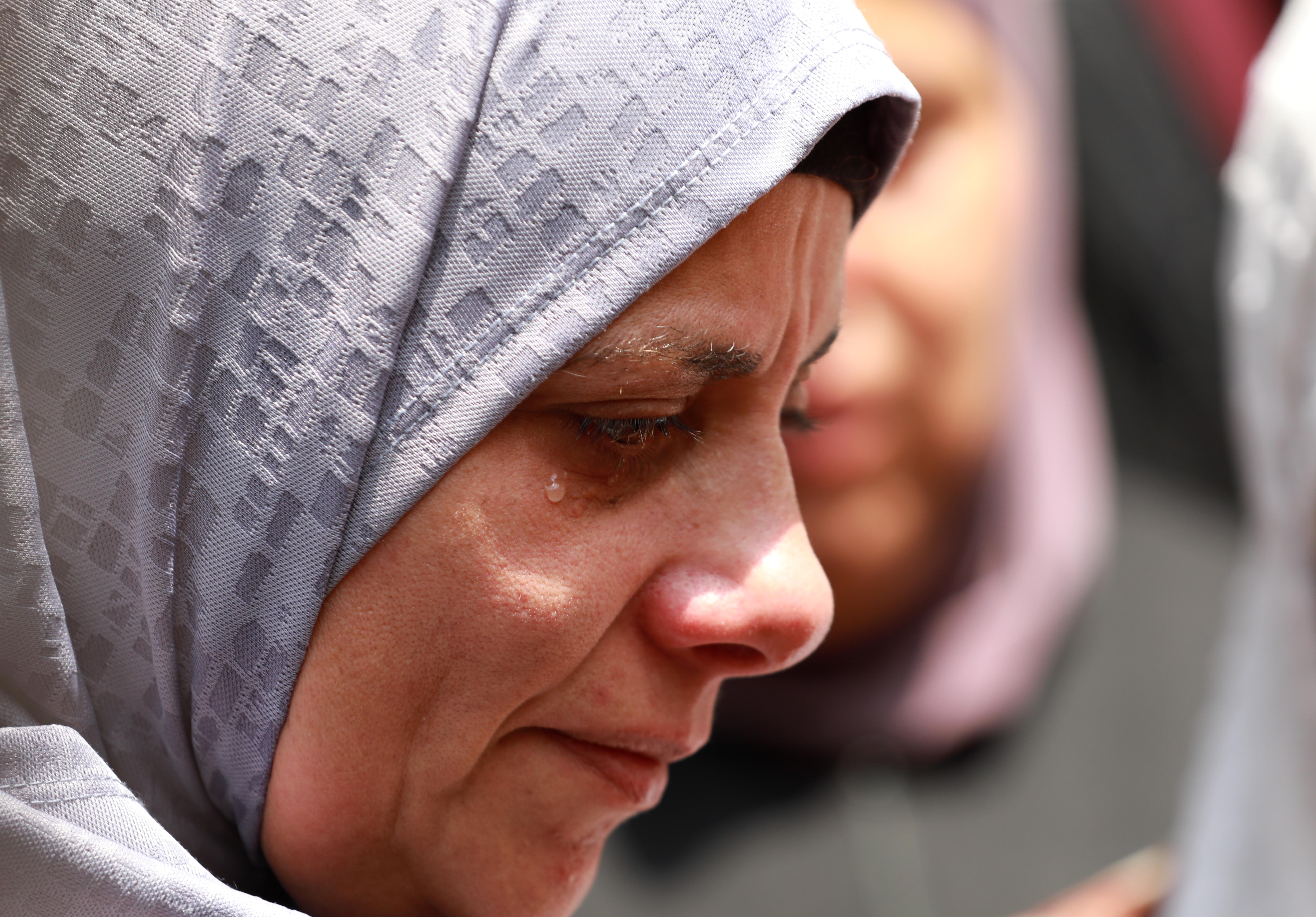 A crying woman in profile