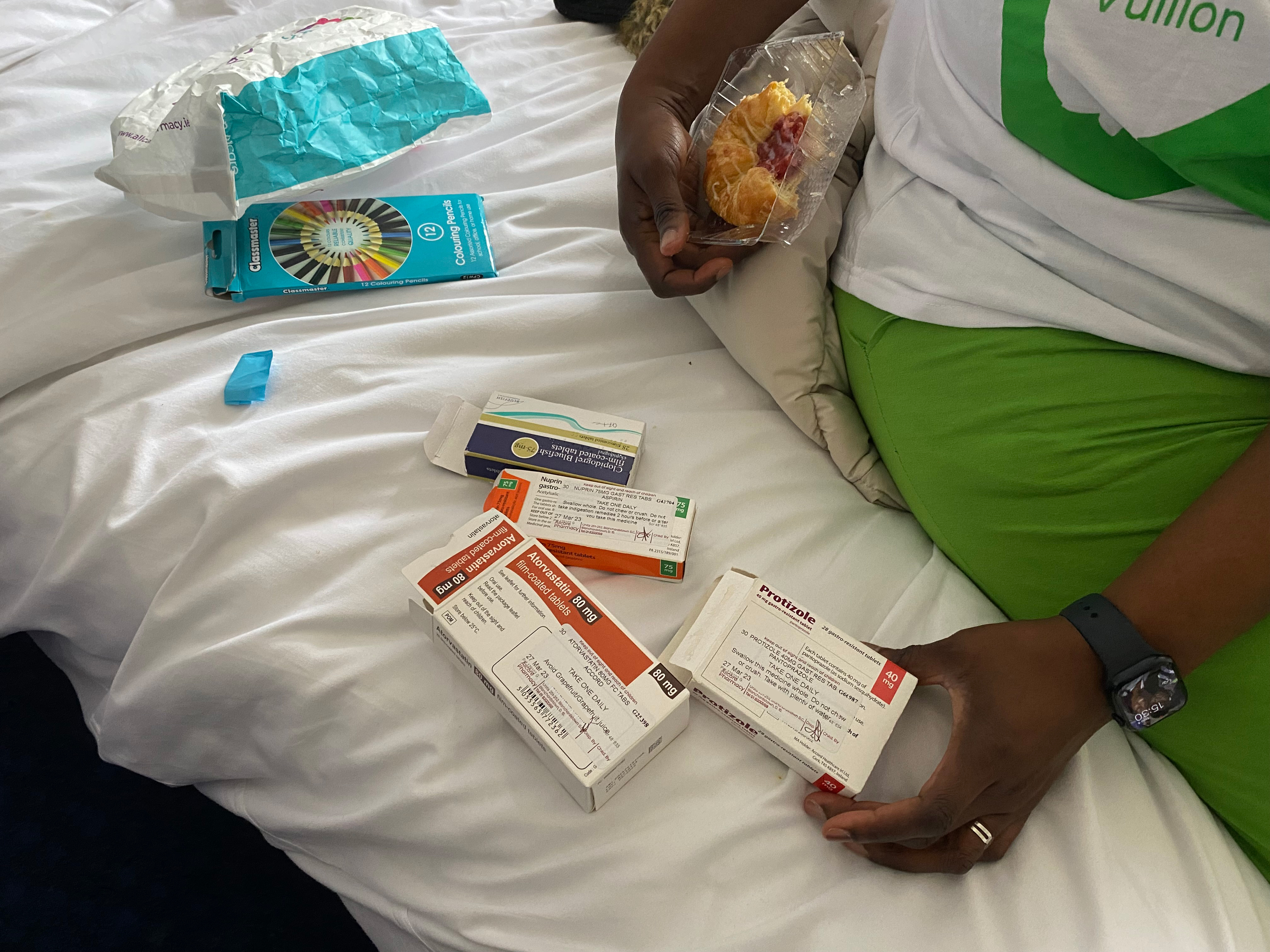 A woman looks at boxes of medicine