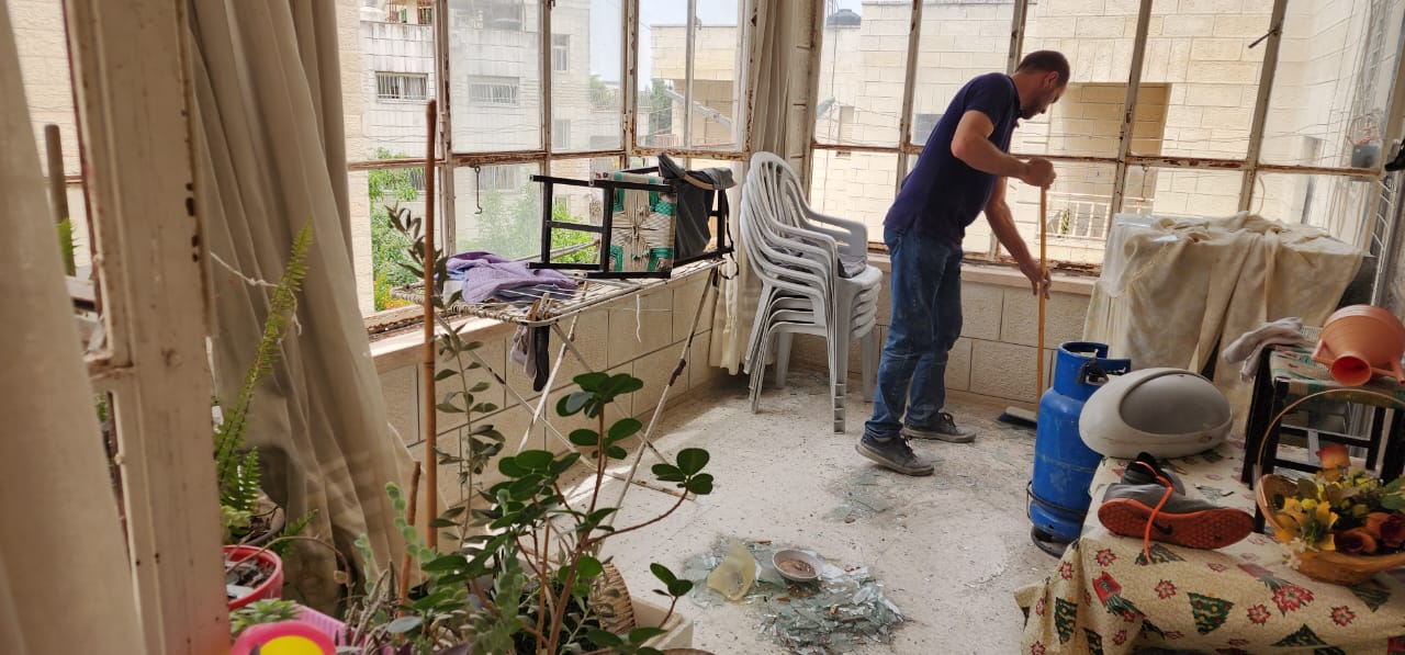 A man sweeps the floor