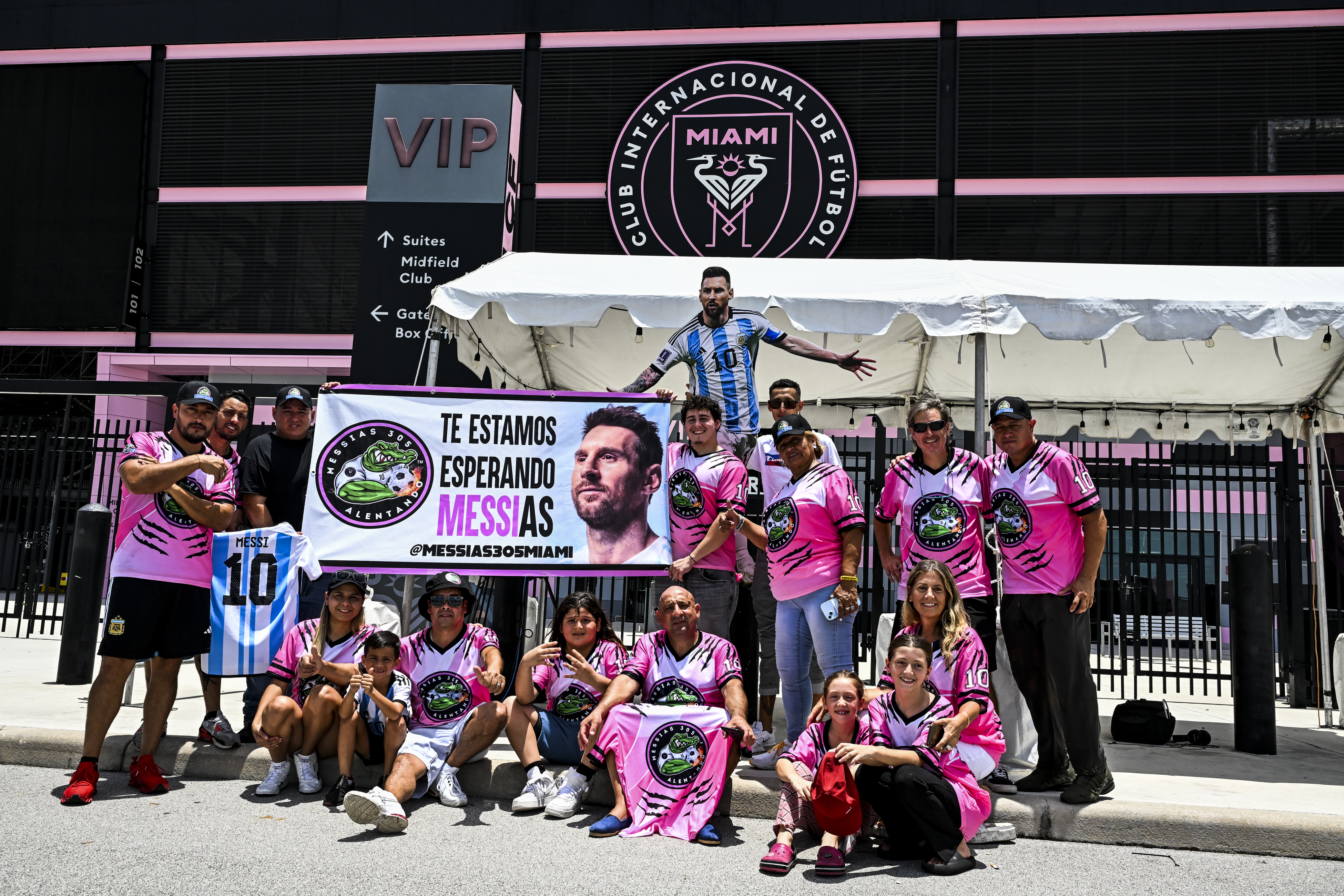 Fans of Argentina's Lionel Messi wait for his arrival at the DRV PNK Stadium in Fort Lauderdale, Florida