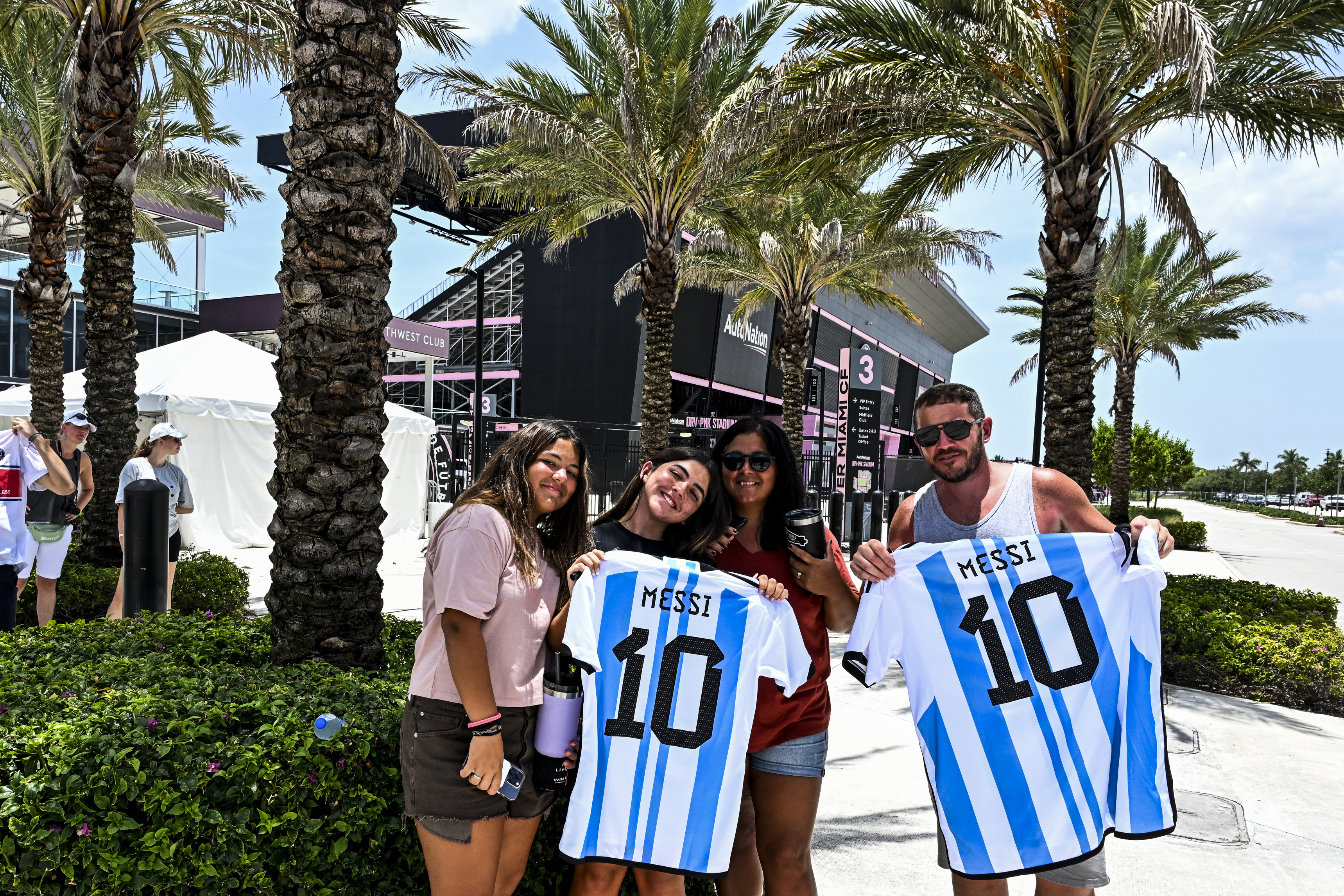Fans of Argentine football player Lionel Messi pose for a photo