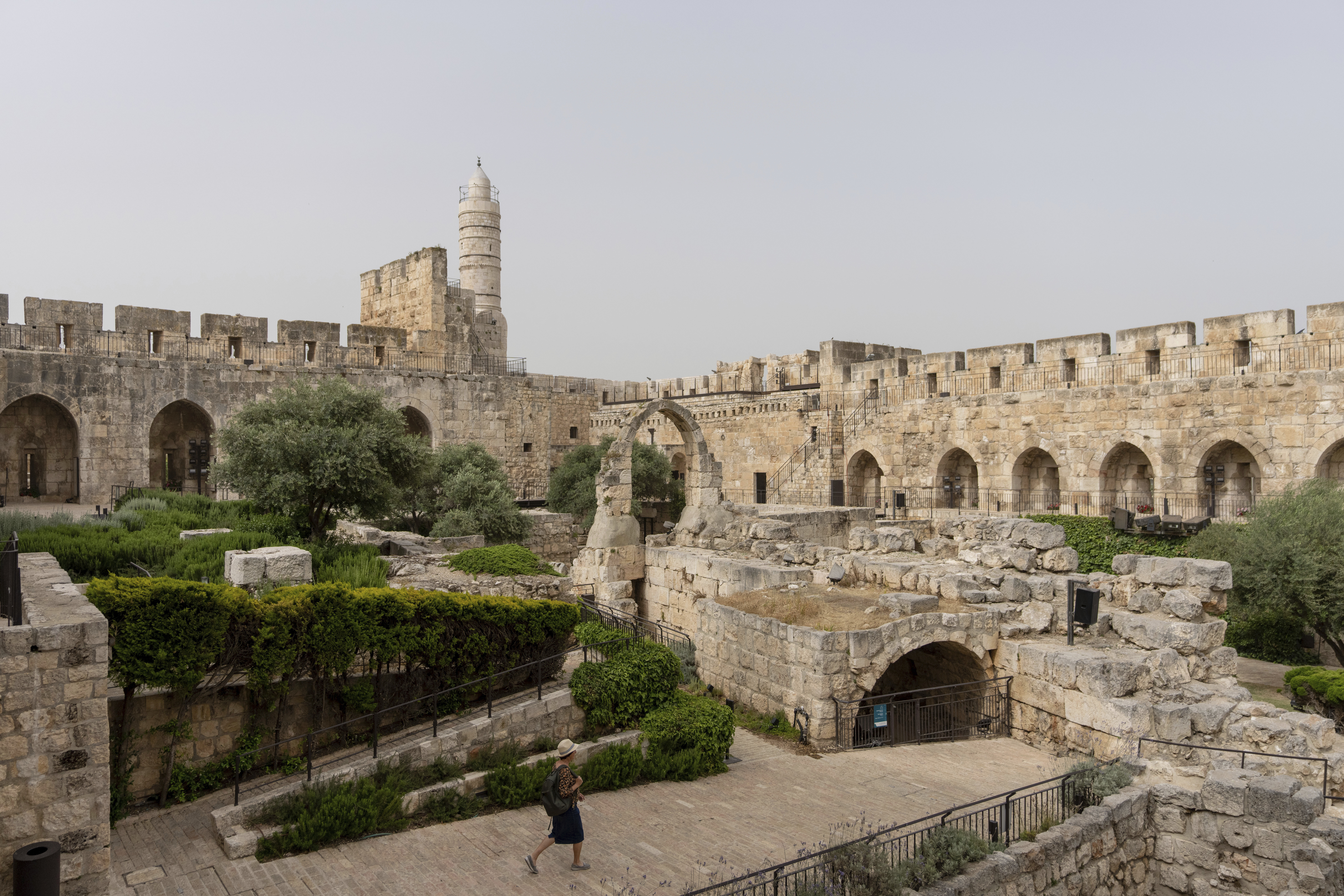 A woman walks at the inner courtyard of the Tower of David Museum, in Jerusalem's Old City, after a three-year renovation project, Monday, May 22, 2023. The tower, an ancient fortress on the western edge of the Old City, contains remnants of successive fortifications built one atop the other dating back over two millennia. (AP Photo/Ohad Zwigenberg)