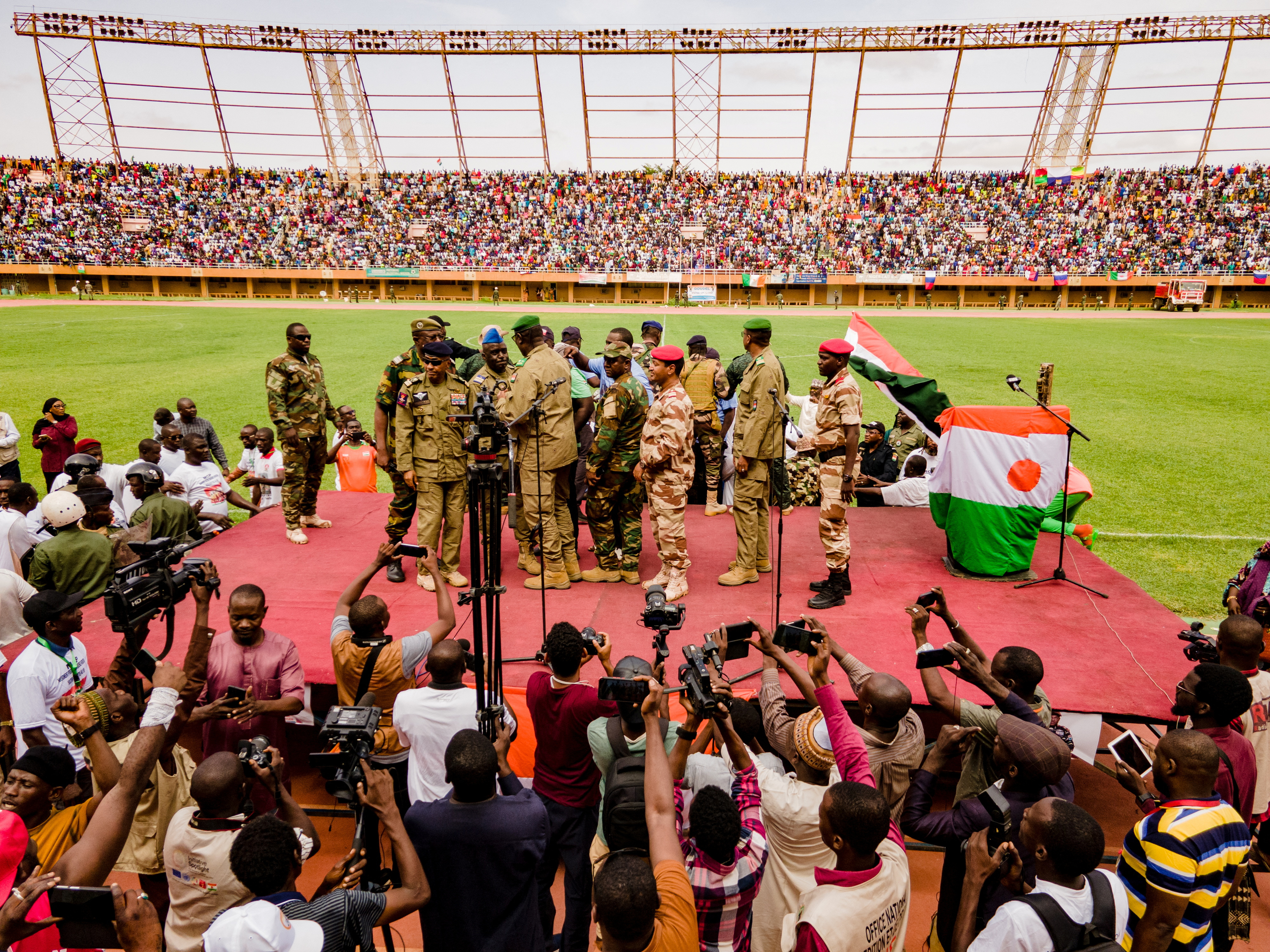 Supporters of Niger's coup leaders take part in a rally at a stadium in Niamey, Niger