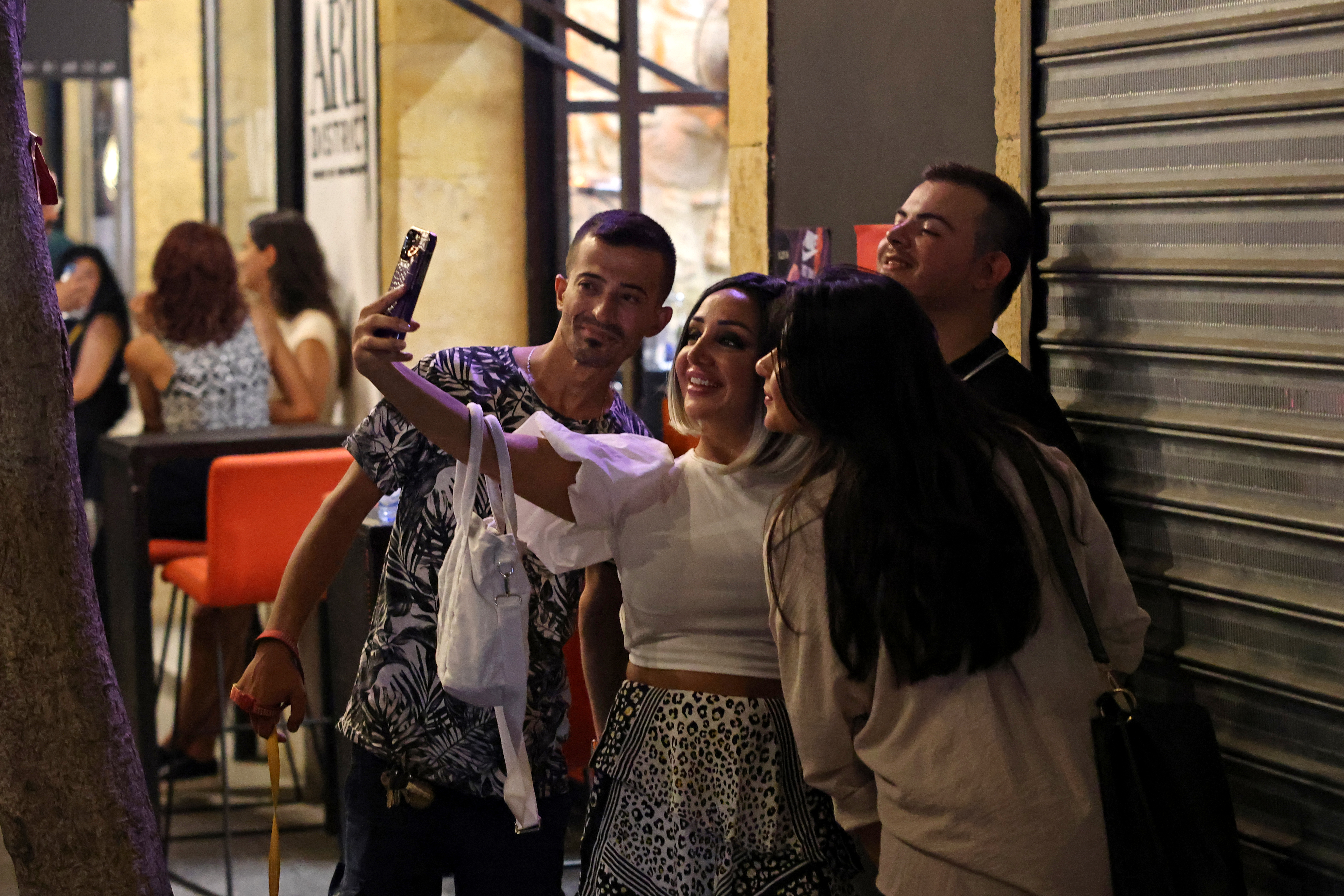People take a picture in the historic Gemmayzeh district
