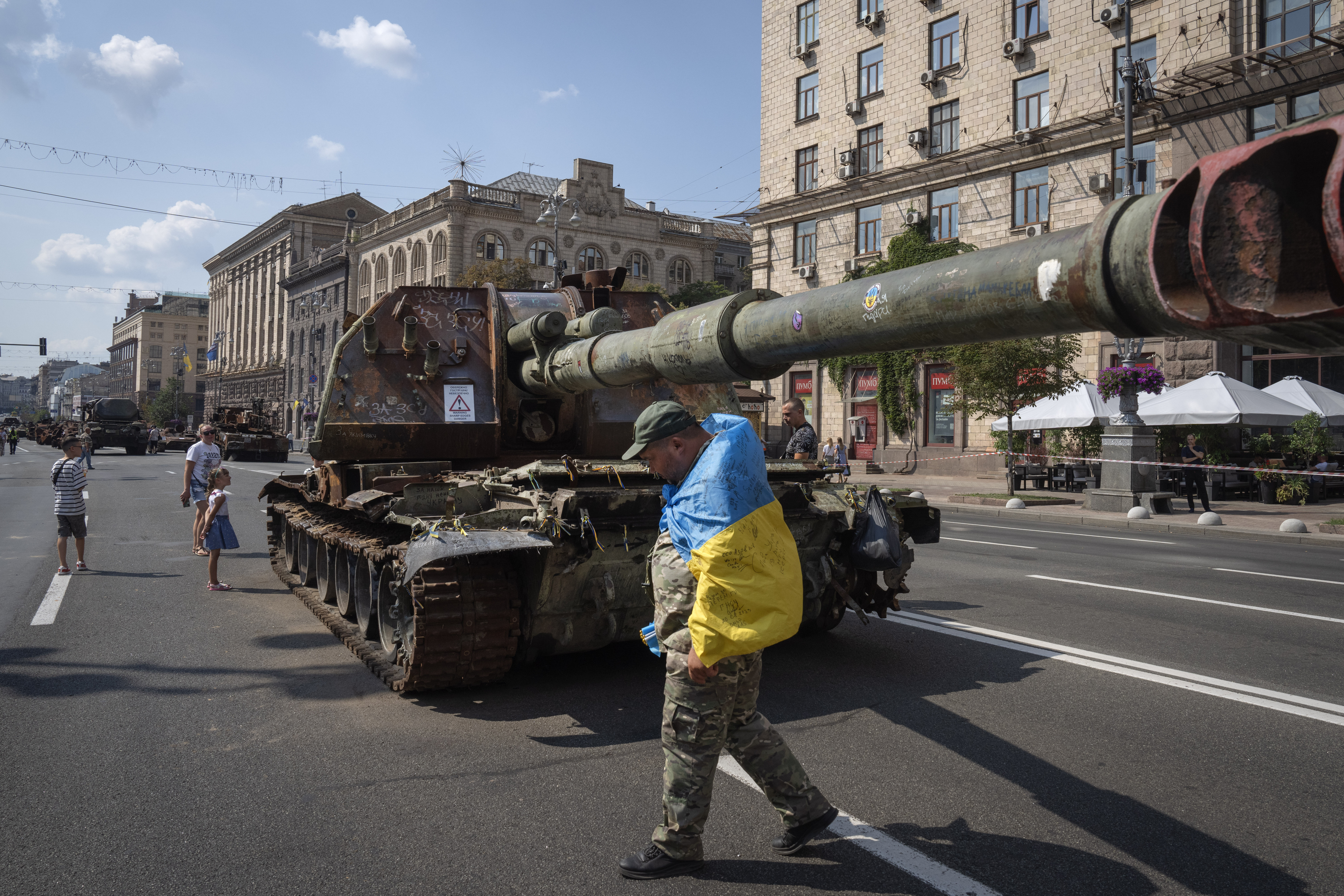 A man wearing a Ukrainian flag