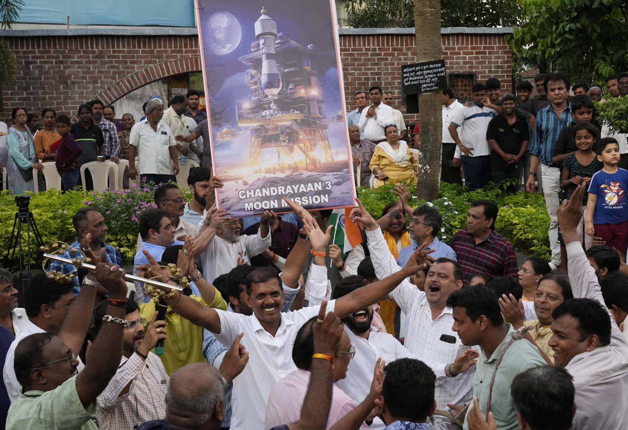 People celebrate as they watch a live telecast of the landing og Chandrayaan-3, or “moon craft” in Sanskrit, in Mumbai, India, Wednesday, Aug. 23, 2023.