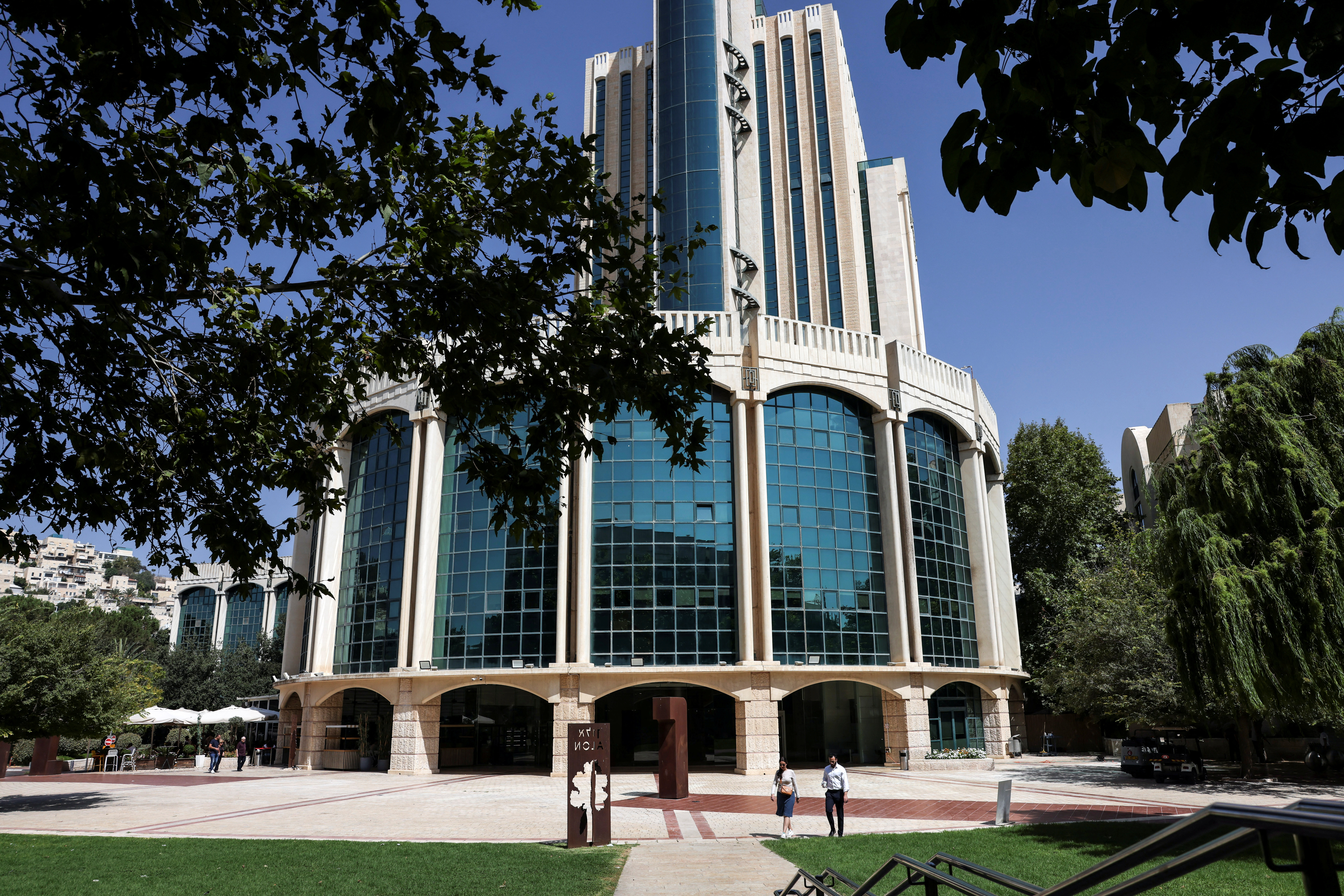 Israelis walk by the building where the Papua New Guinea embassy is