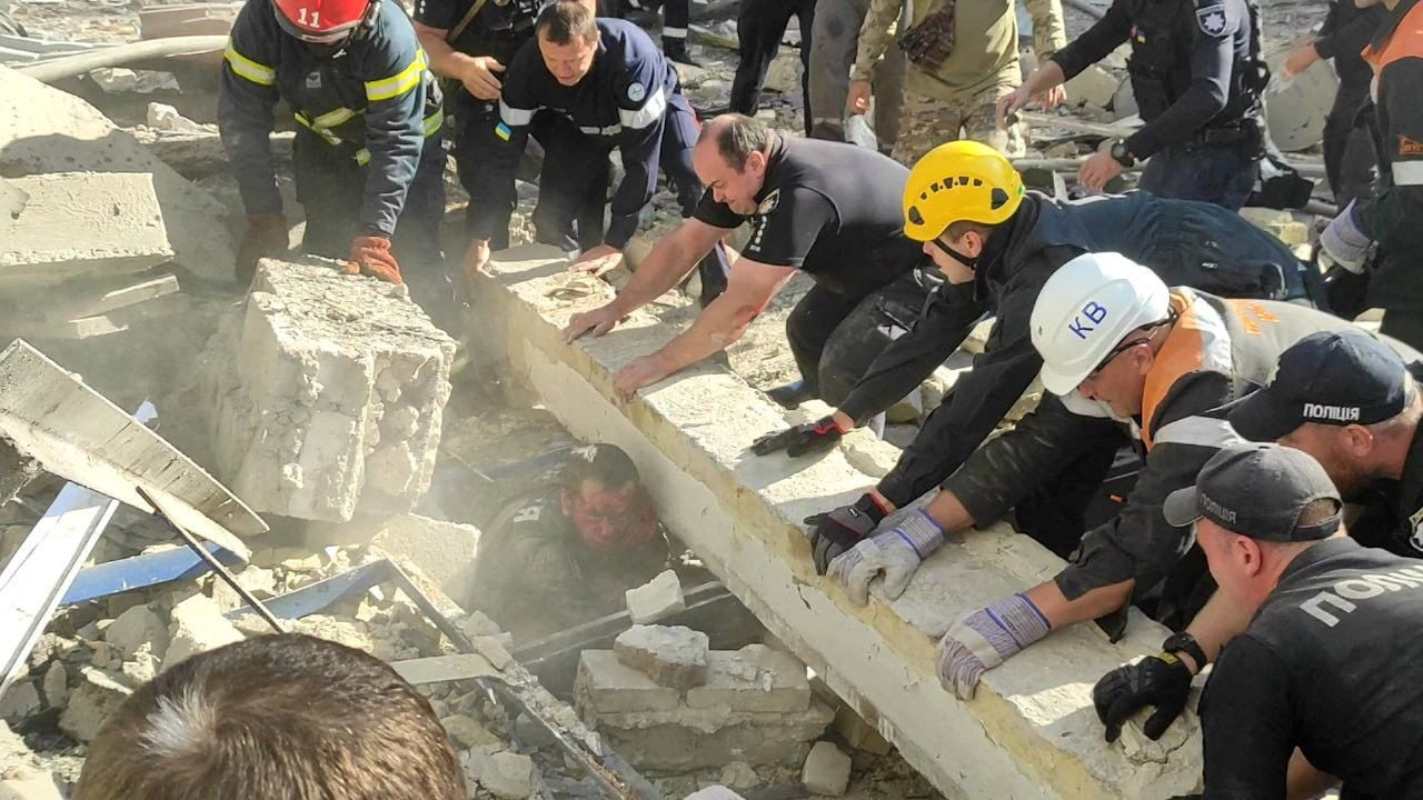 Rescuers and police officers work to release a police officer from debris at a site of a Russian missile strike, amid Russia's attack on Ukraine, in Kryvyi Rih, Dnipropetrovsk region, Ukraine September 8, 2023. Press service of the Interior Ministry of Ukraine/Handout via REUTERS ATTENTION EDITORS - THIS IMAGE HAS BEEN SUPPLIED BY A THIRD PARTY.