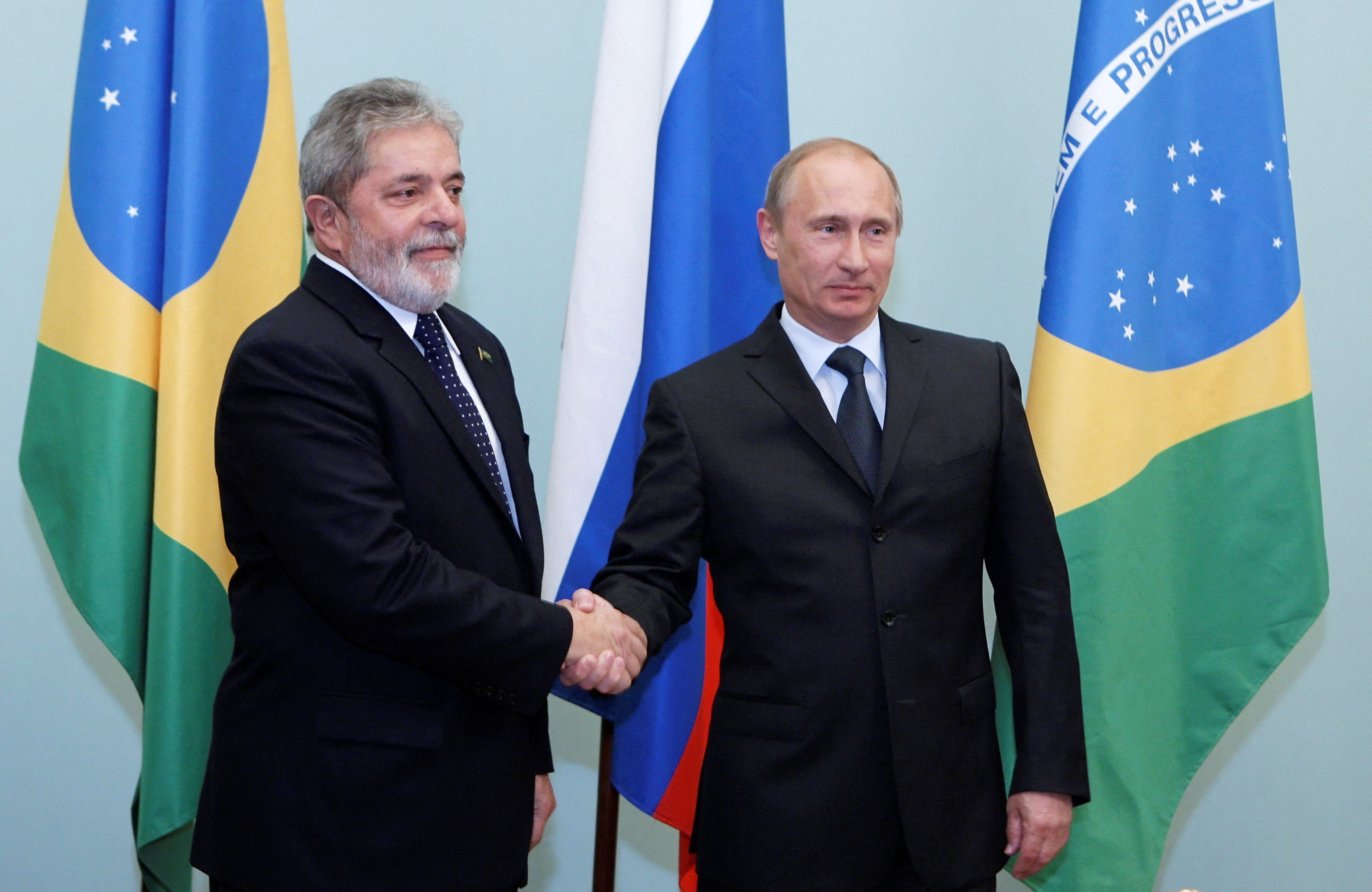 Brazil's President Luiz Ignacio Lula da Silva (L) shakes hands with Russia's Prime Minister Vladimir Putin as they meet in Moscow May 14, 2010.