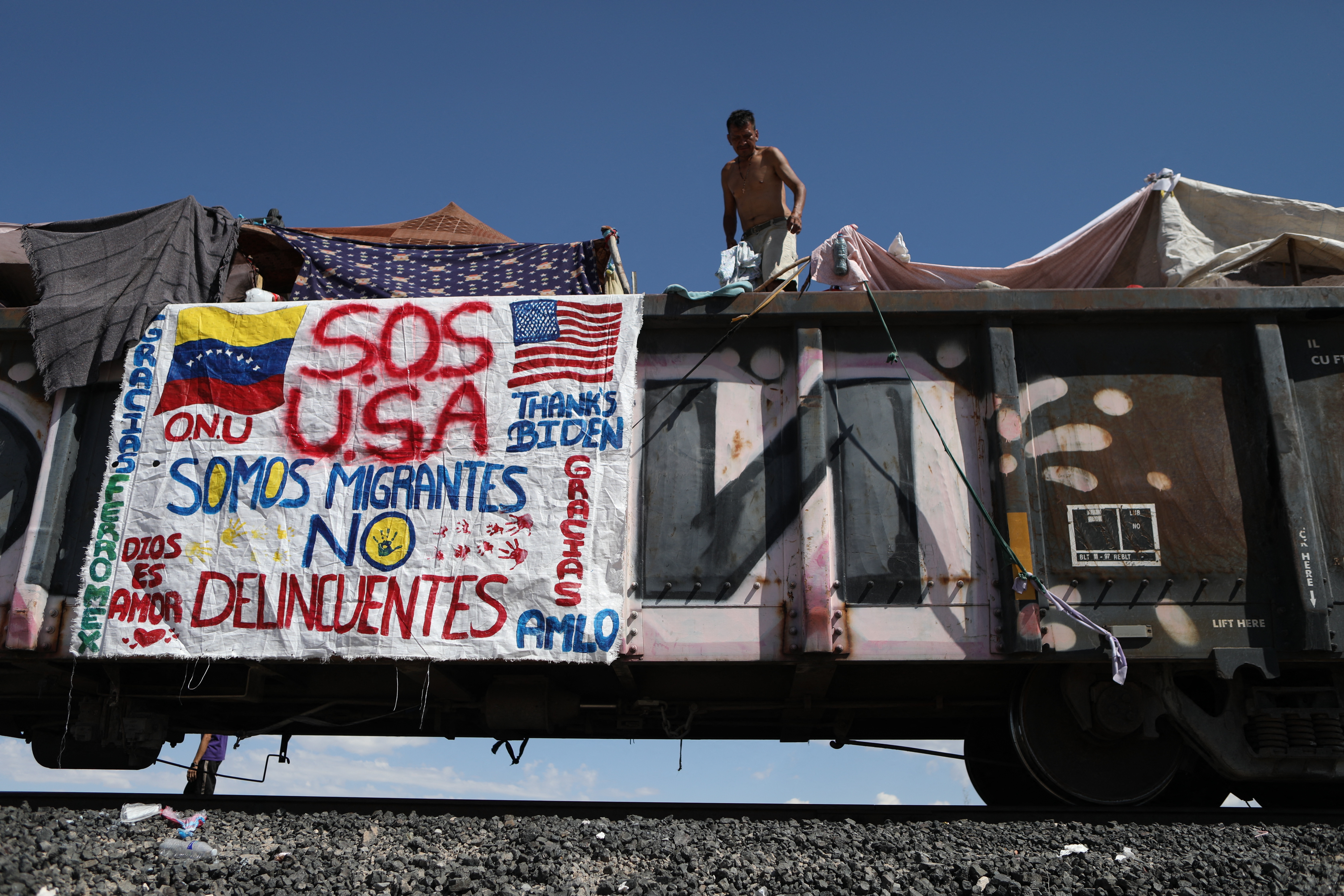 Migrant people, mostly from Venezuela, remain stranded after the goods train they were travelling on to Ciudad Juarez