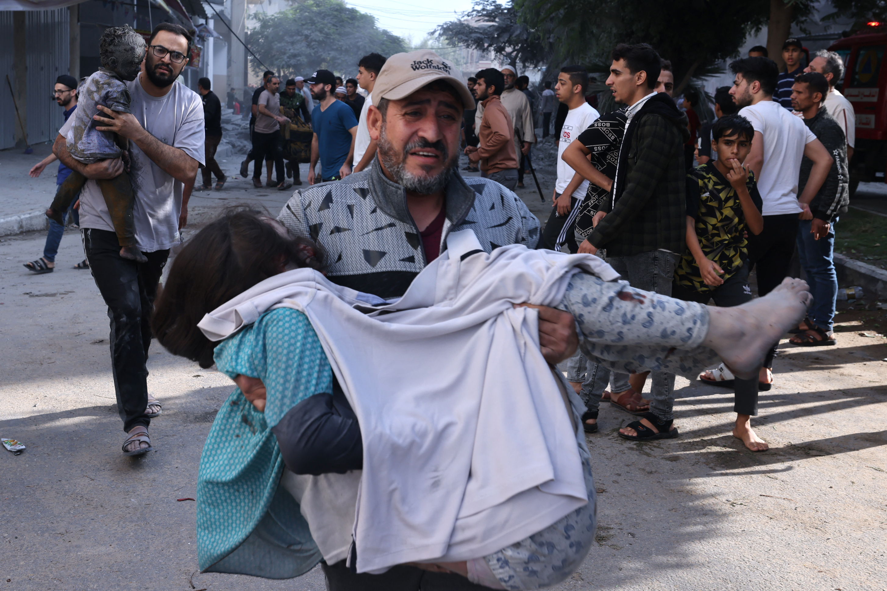A Palestinian reacts amidst the rubble of a building after an Israeli airstrike on the Rafah