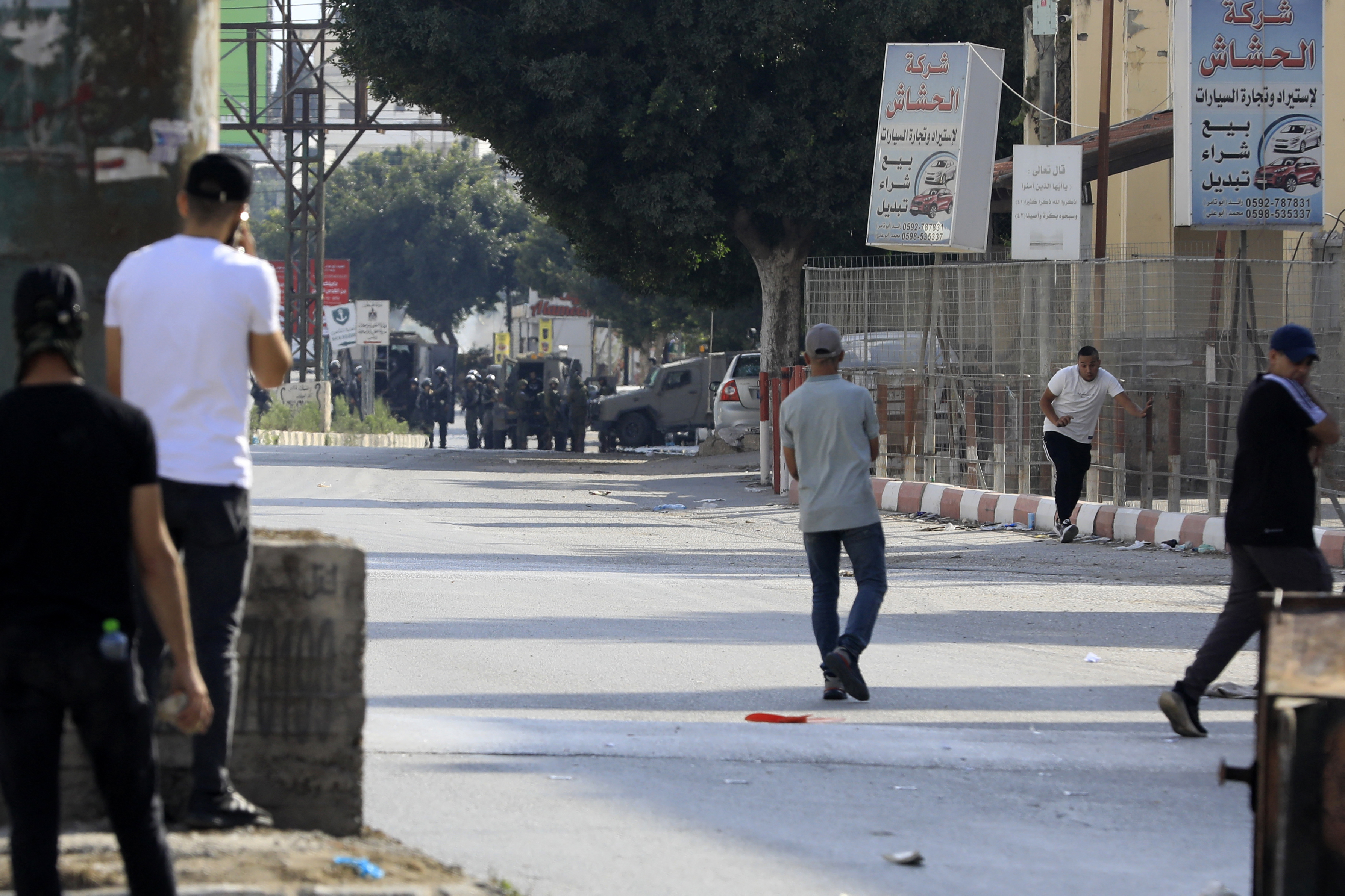 Palestinians demonstrators clash with Israeli soldiers near Huwara checkpoint, the southern entrance to Nablus city, in the occupied West Bank